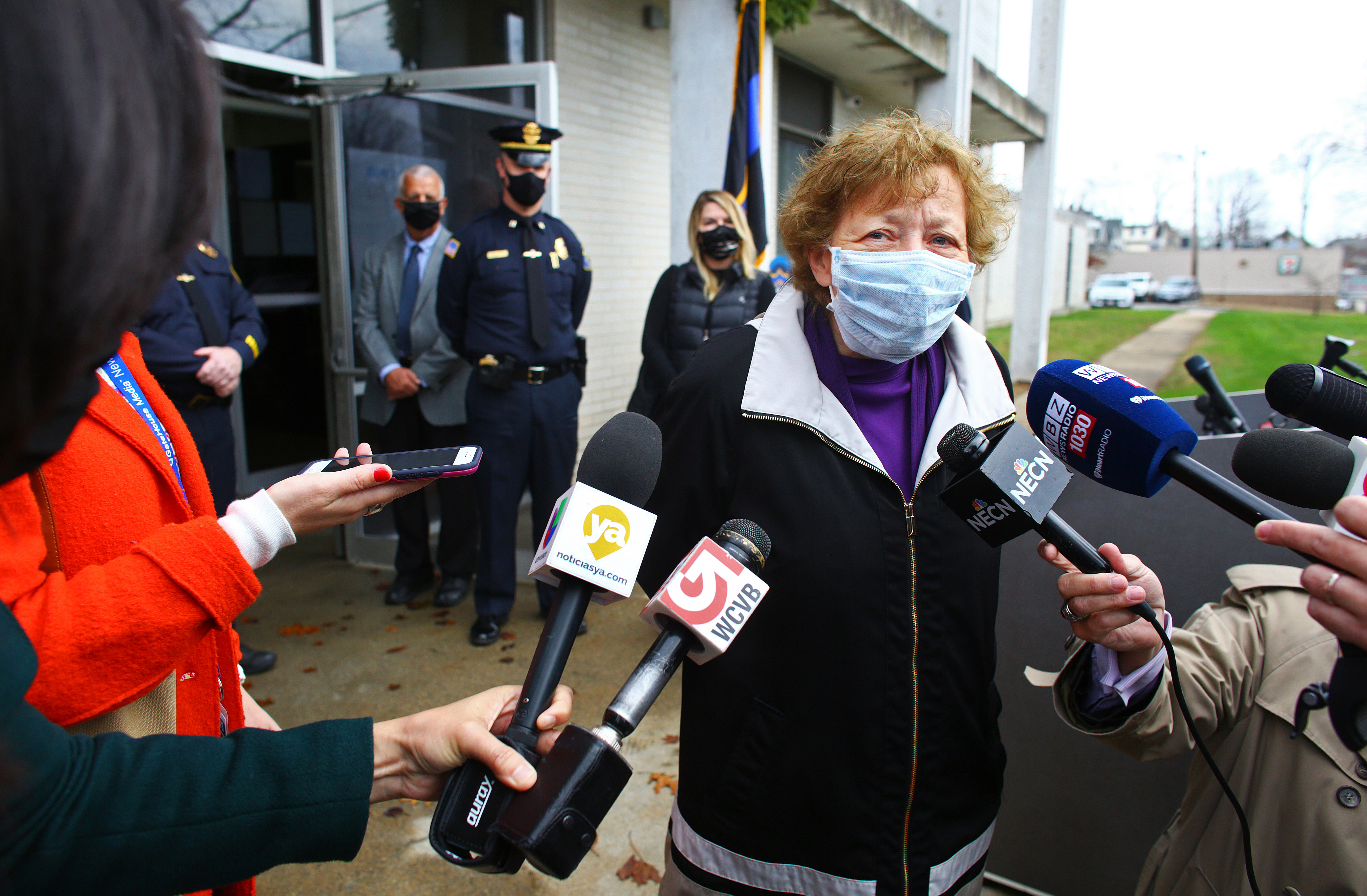 Waltham Mayor Jeannette McCarthy answered questions in front of the Waltham Police station on Tuesday.
