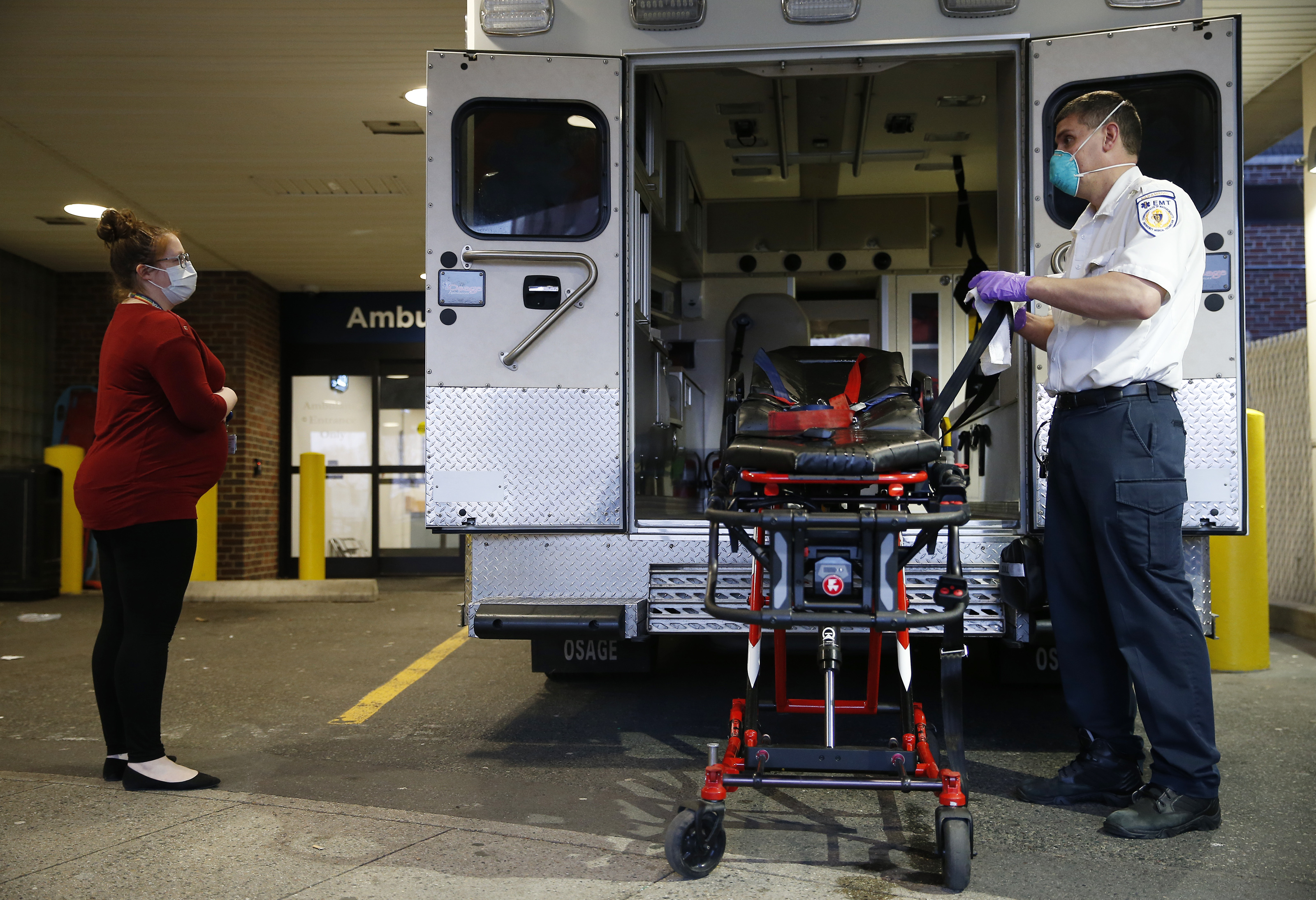 Monday, 7:12 p.m. Ricky chatted with his wife, Tessa, who is seven months pregnant and works inside at CHA Everett Hospital as he disinfected the stretcher after dropping a patient off at the emergency room there during his 24-hour shift. The couple kept their distance out of concerns over COVID-19.