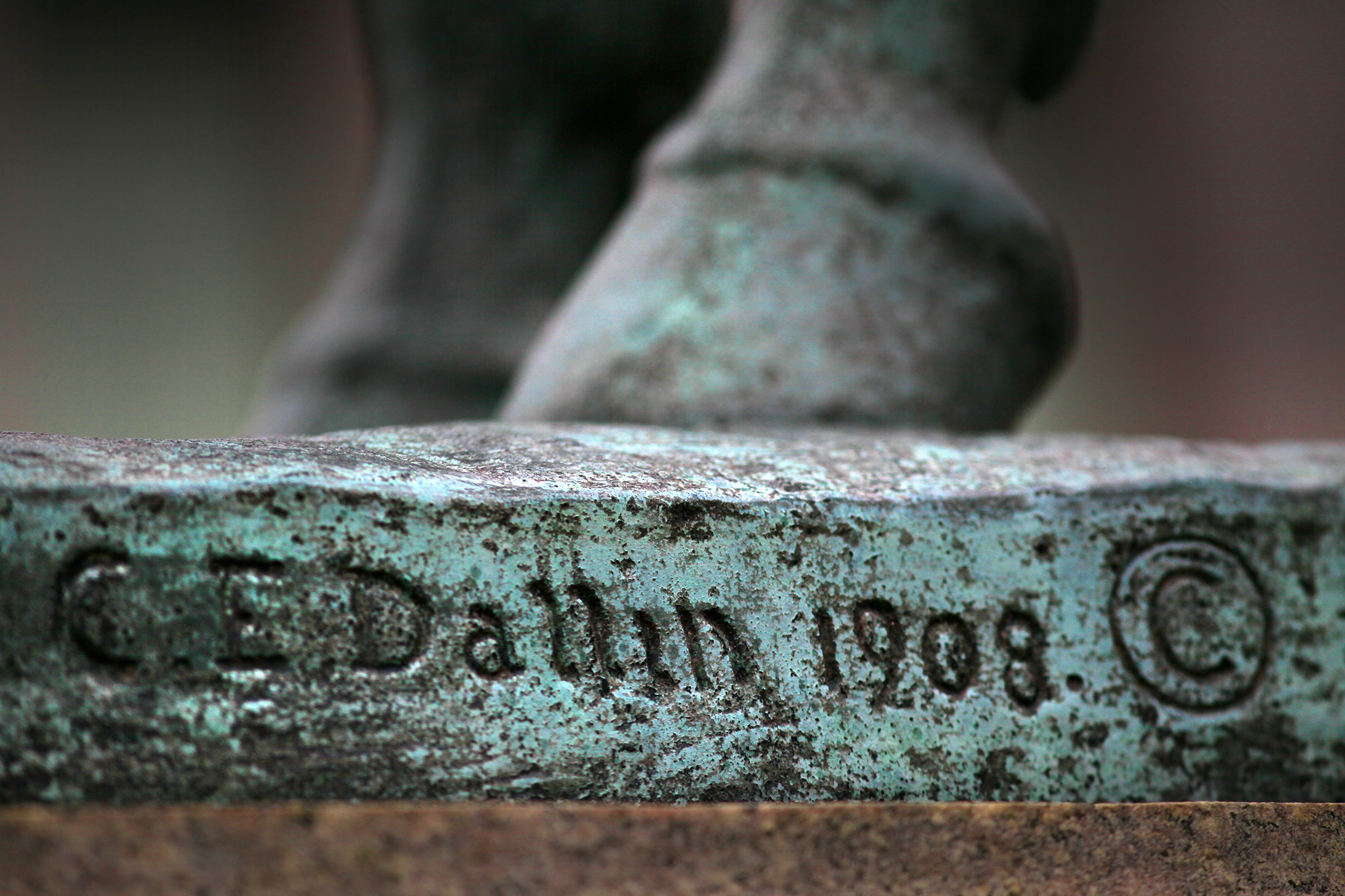Cyrus Dallin's signature inscribed in the base of "Appeal to the Great Spirit" outside the Museum of Fine Arts.