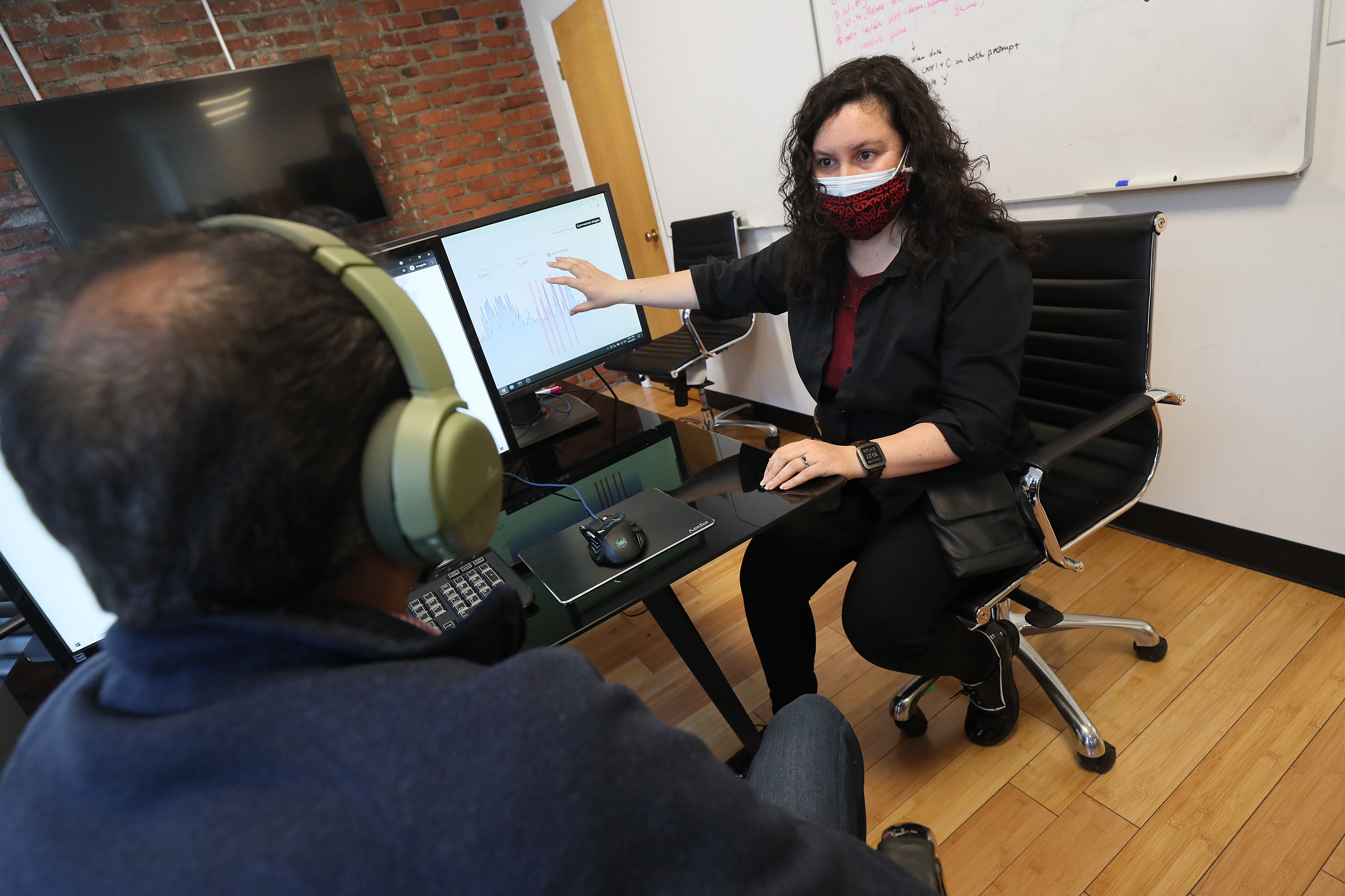 At Neurable, research engineer Mavi Ruiz Blondet works on some tests of the startup's product. They are developing a pair of headphones that not only play music, but can gauge your focus and attentiveness.
