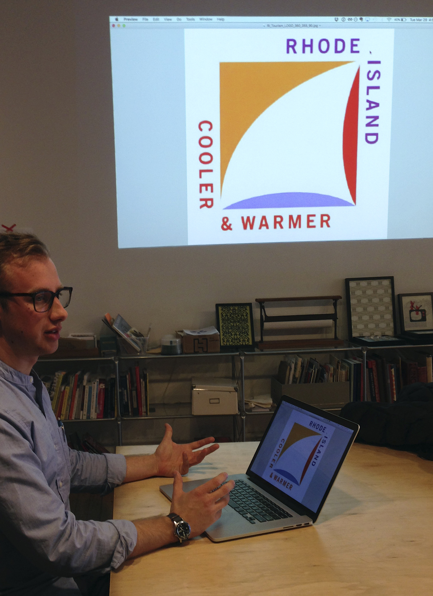 Greg Nemes, of the design firm Work-Shop, displays the new logo for a campaign to attract tourism and business to Rhode Island in 2016. The state released the logo, created by Milton Glaser, whose past work includes the iconic "I Love NY" logo.