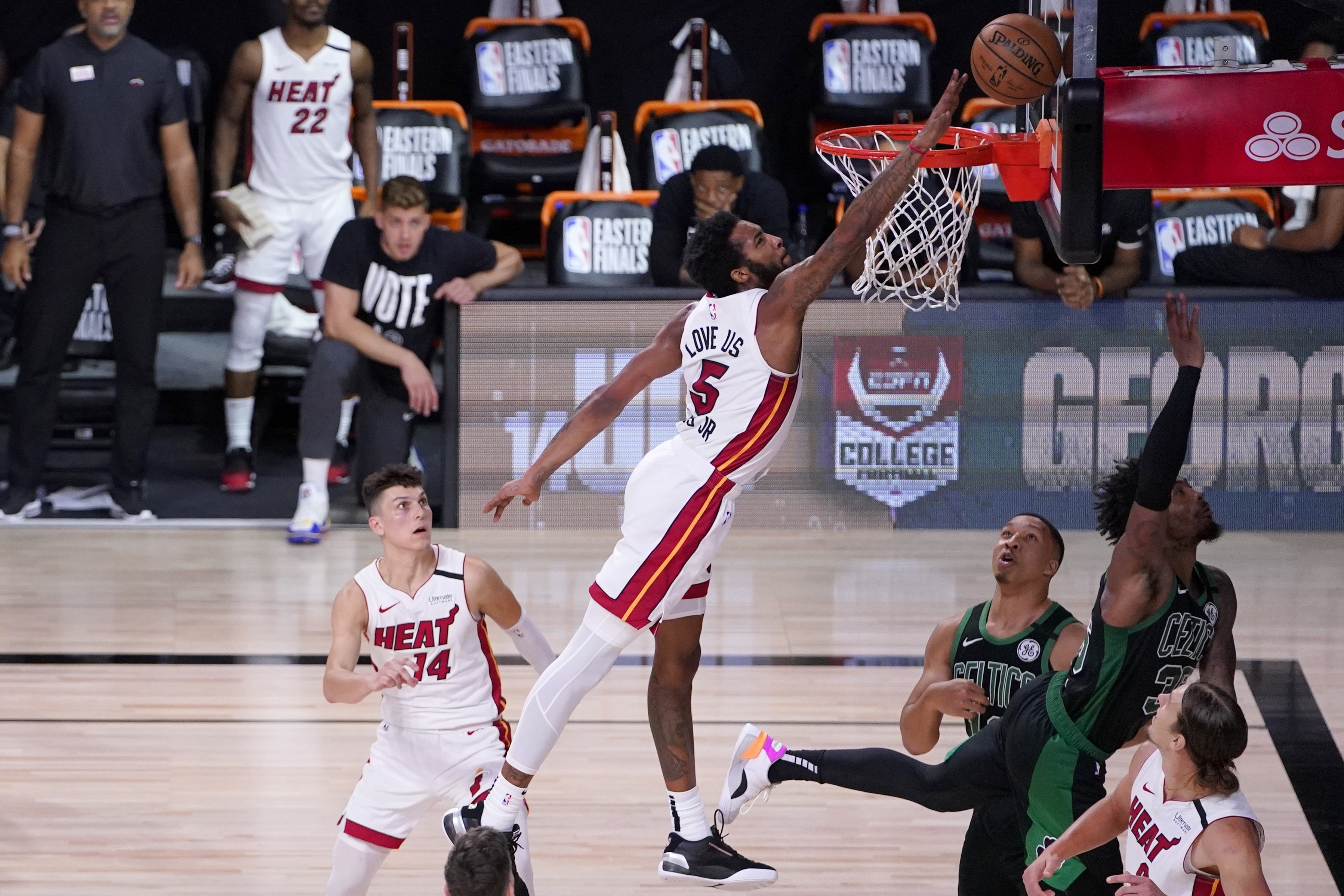 Miami's Derrick Jones Jr. blocks a shot from Marcus Smart during Thursday's Game 2.
