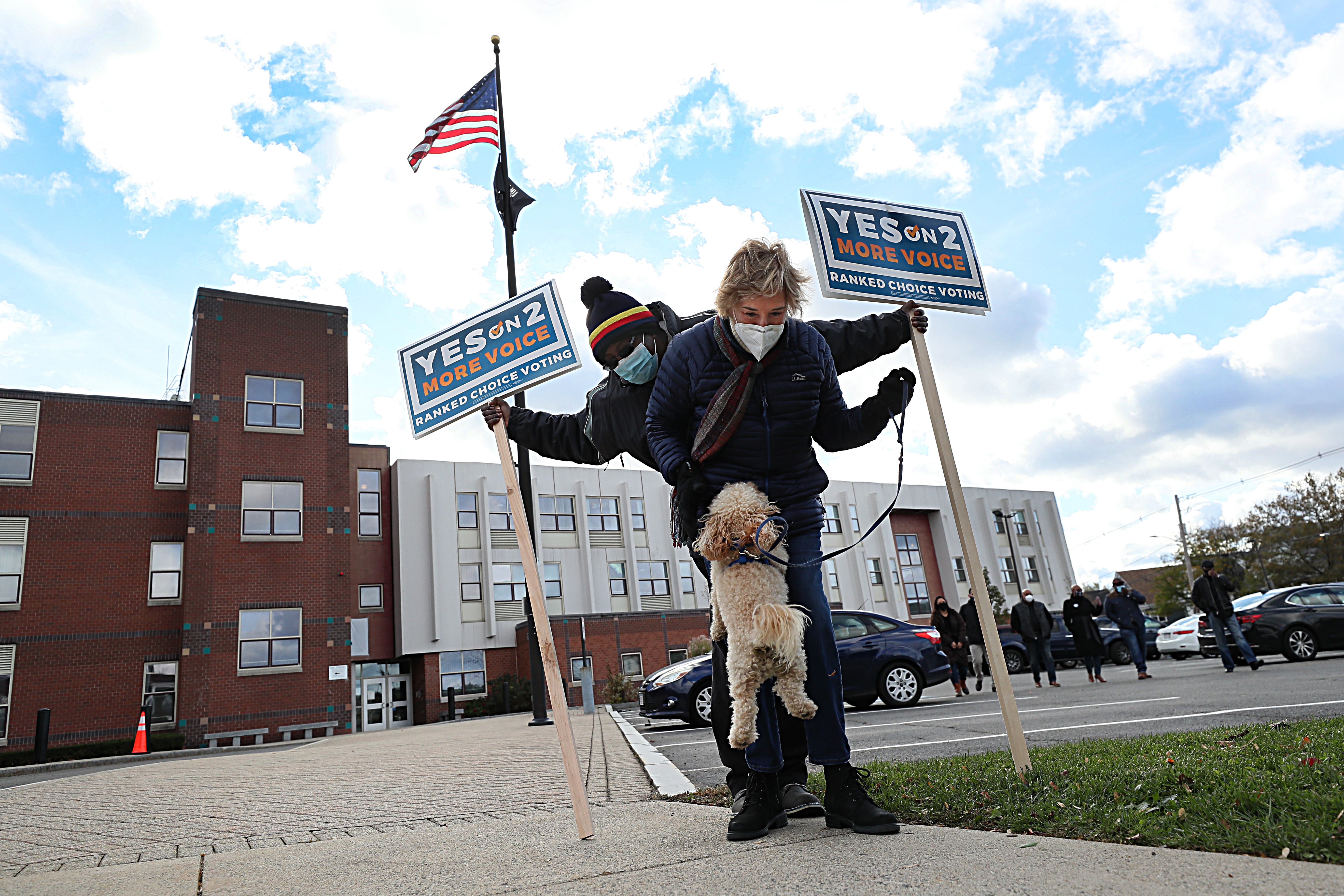 Avi the dog showed support for Ranked Choice Voting at a rally which was joined by Congresswoman Ayanna Pressley outside the polling station at the JFK School.