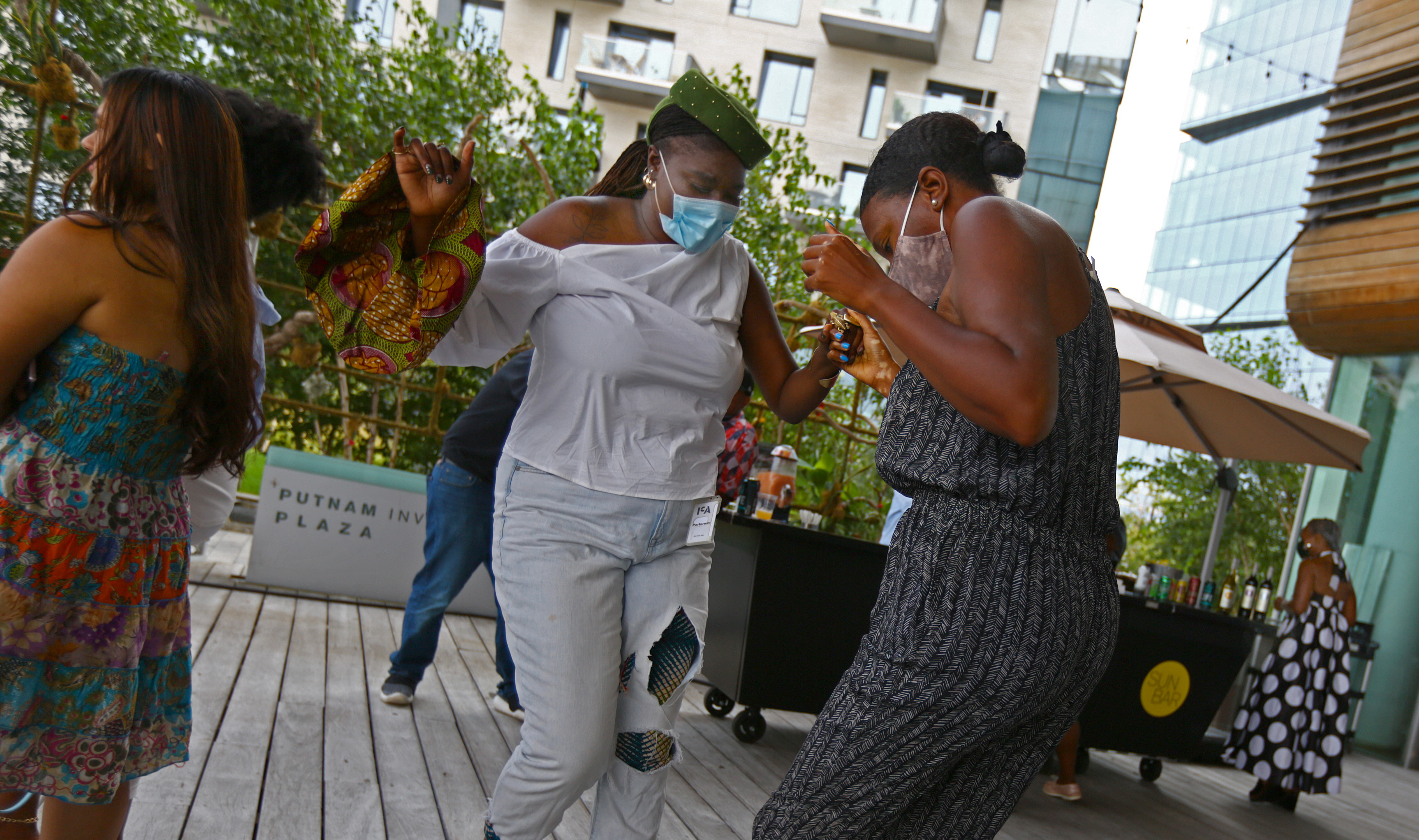 Performer Dzidzor Azaglo (left) and Nieisha Deed were moved to dance at Black Joy Day 2021 on Sept. 9.