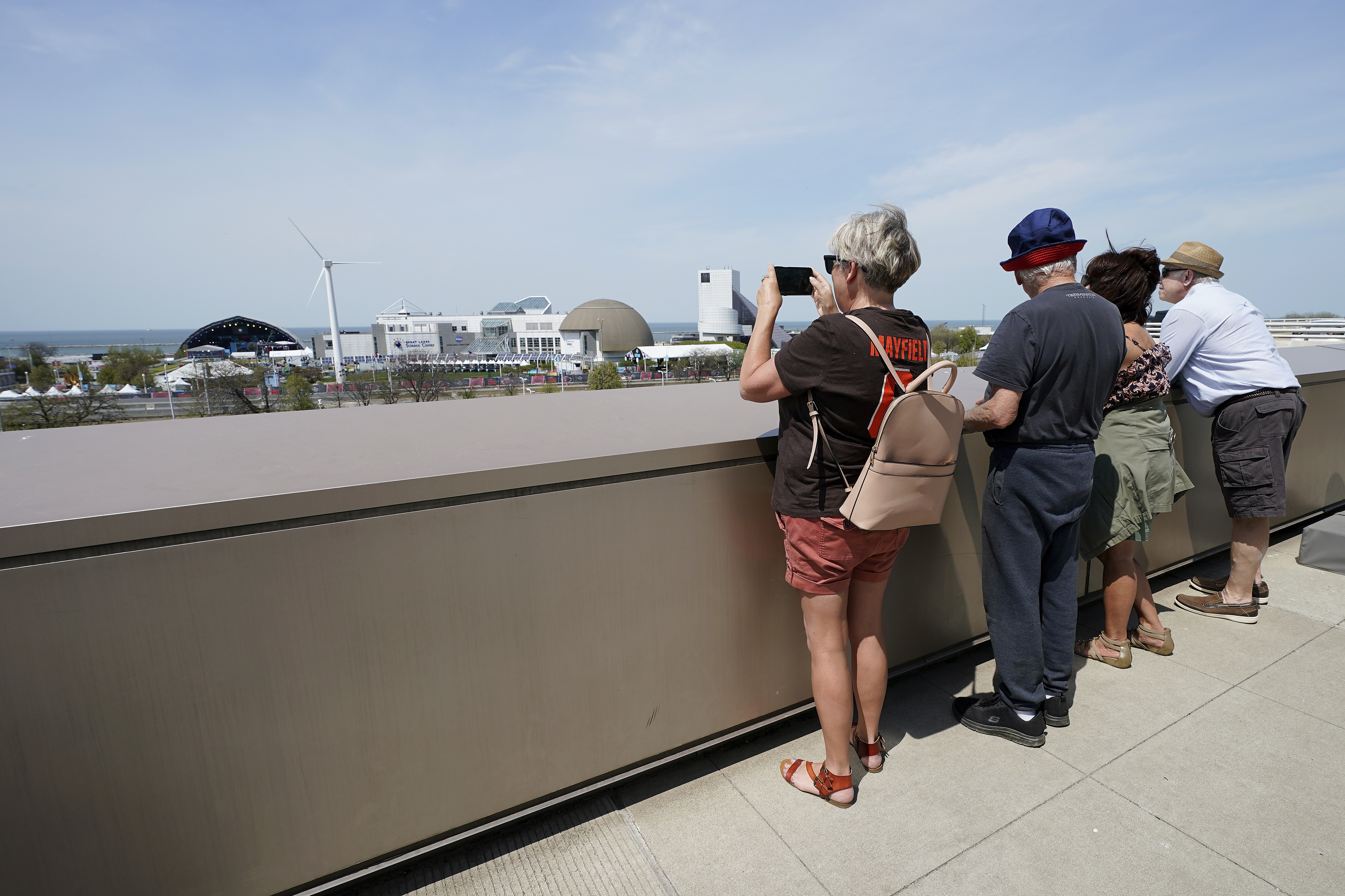 Fans take pictures of the NFL Draft stage being set up for this week's festivities in Cleveland.