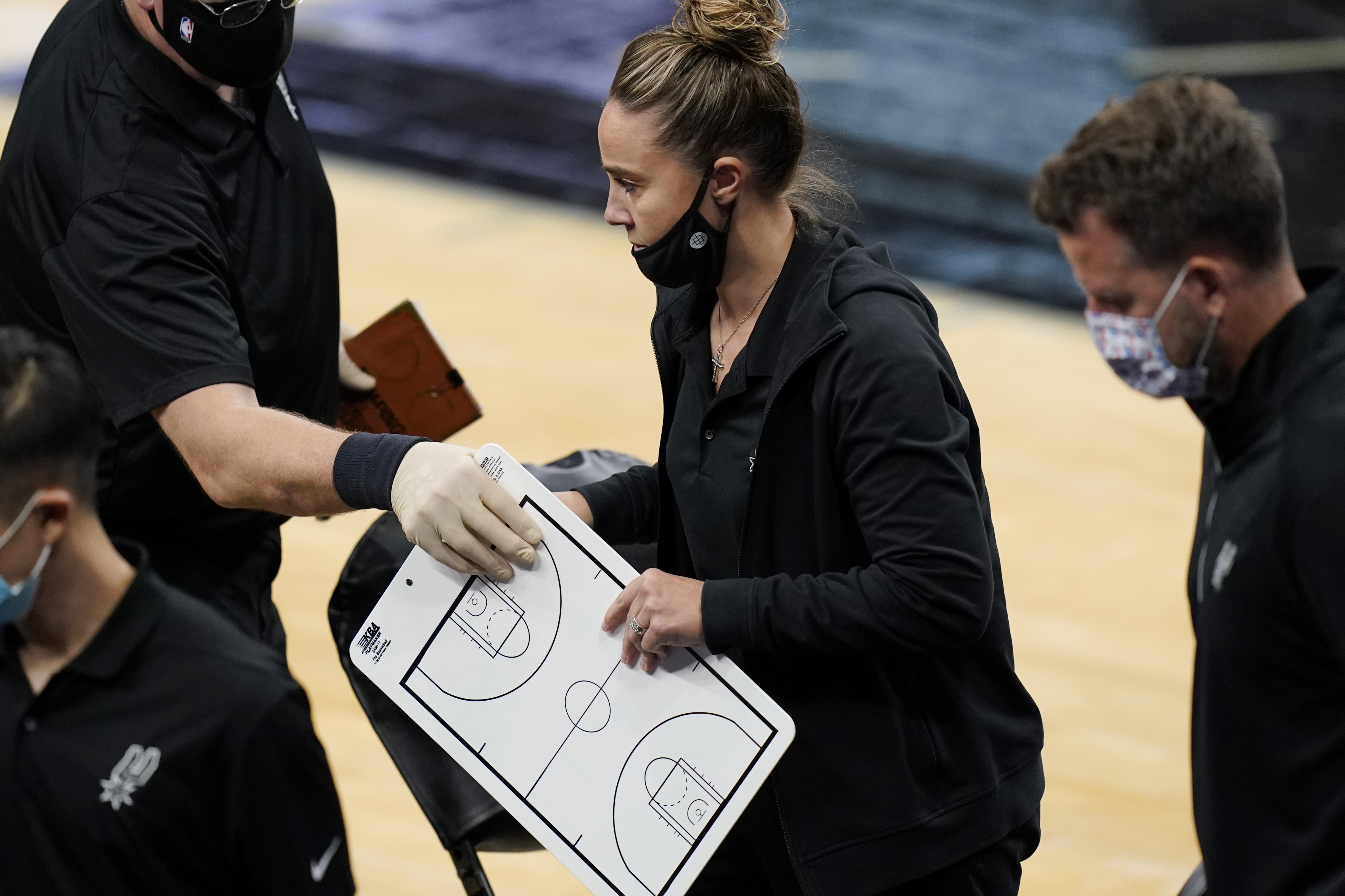 Becky Hammon breaks from a huddle during a timeout in the second half of Wednesday's game.