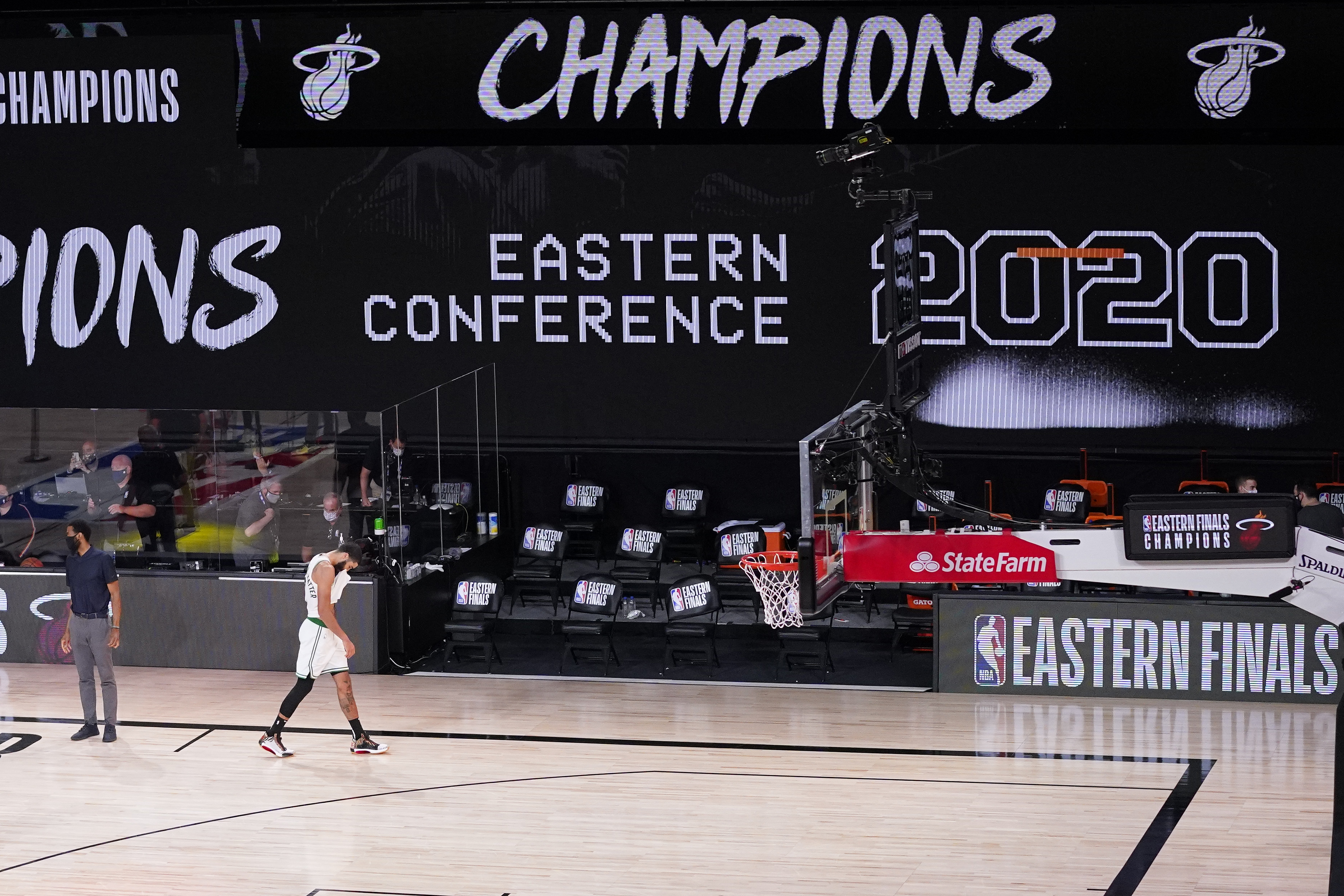Jayson Tatum walks off the court after the final playoff loss to Miami.