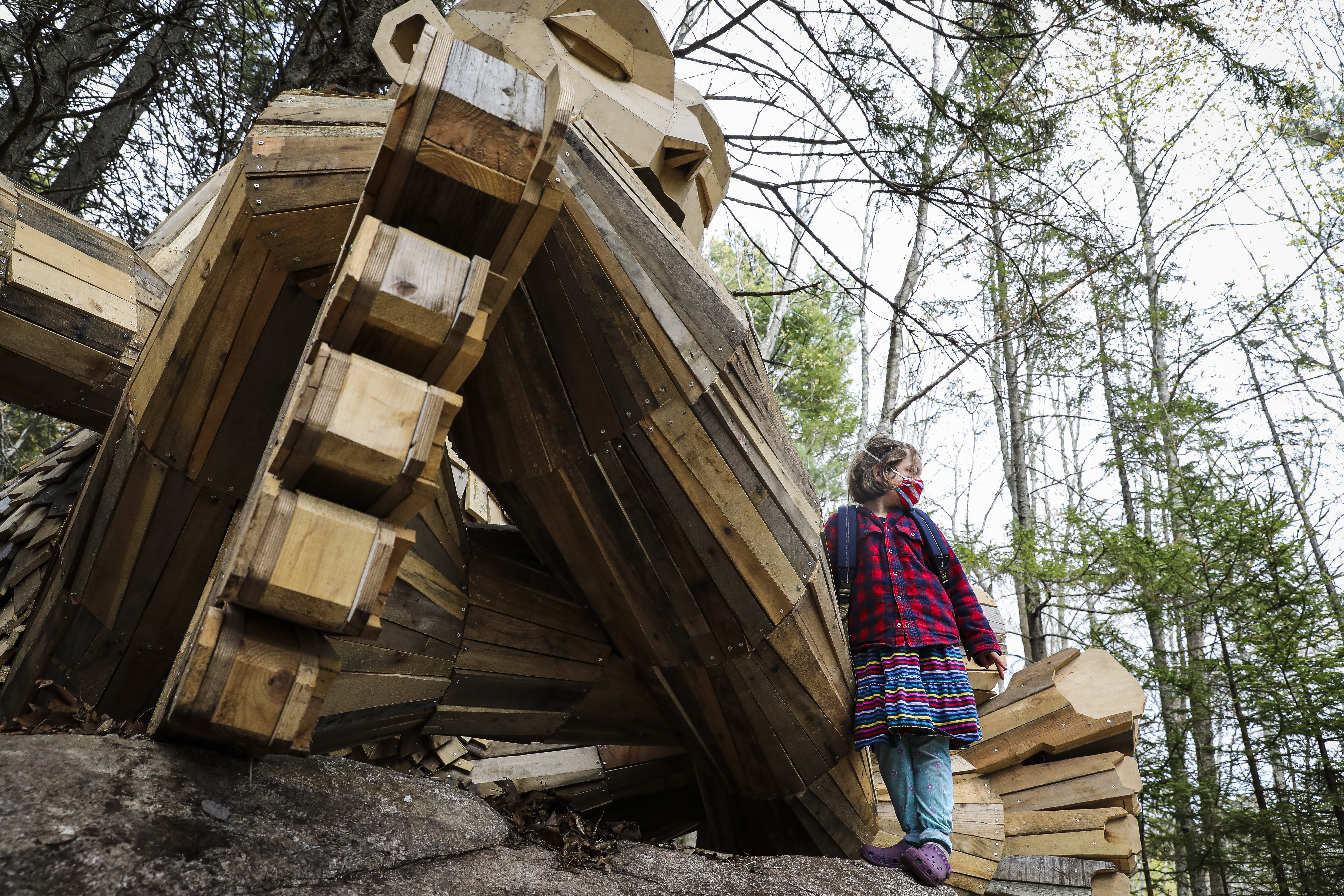 Adelaide Trafton played with troll Gro in the Coastal Maine Botanical Gardens.