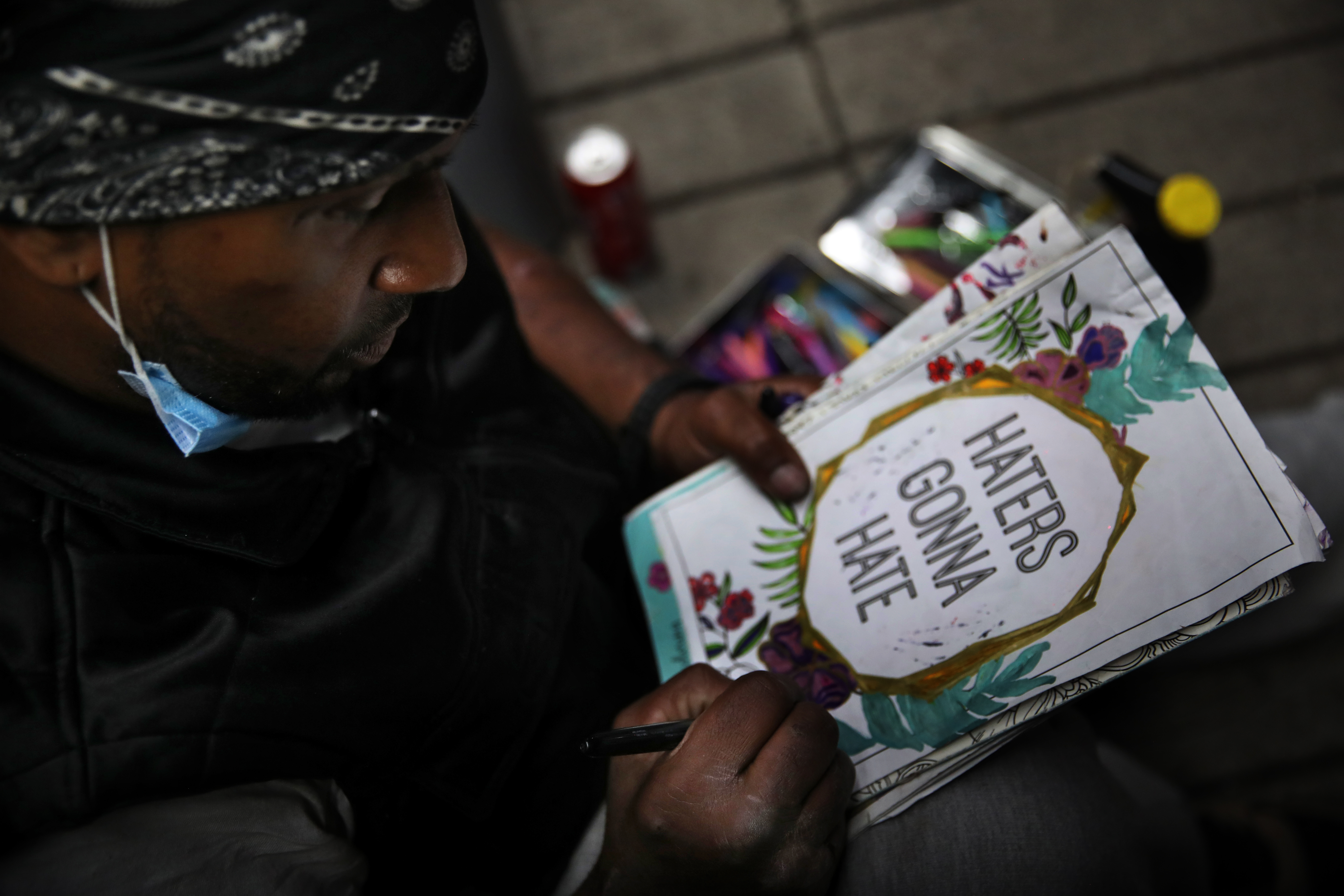 Juan Maisonet did some artwork outside the Mobil station on Southampton Street.