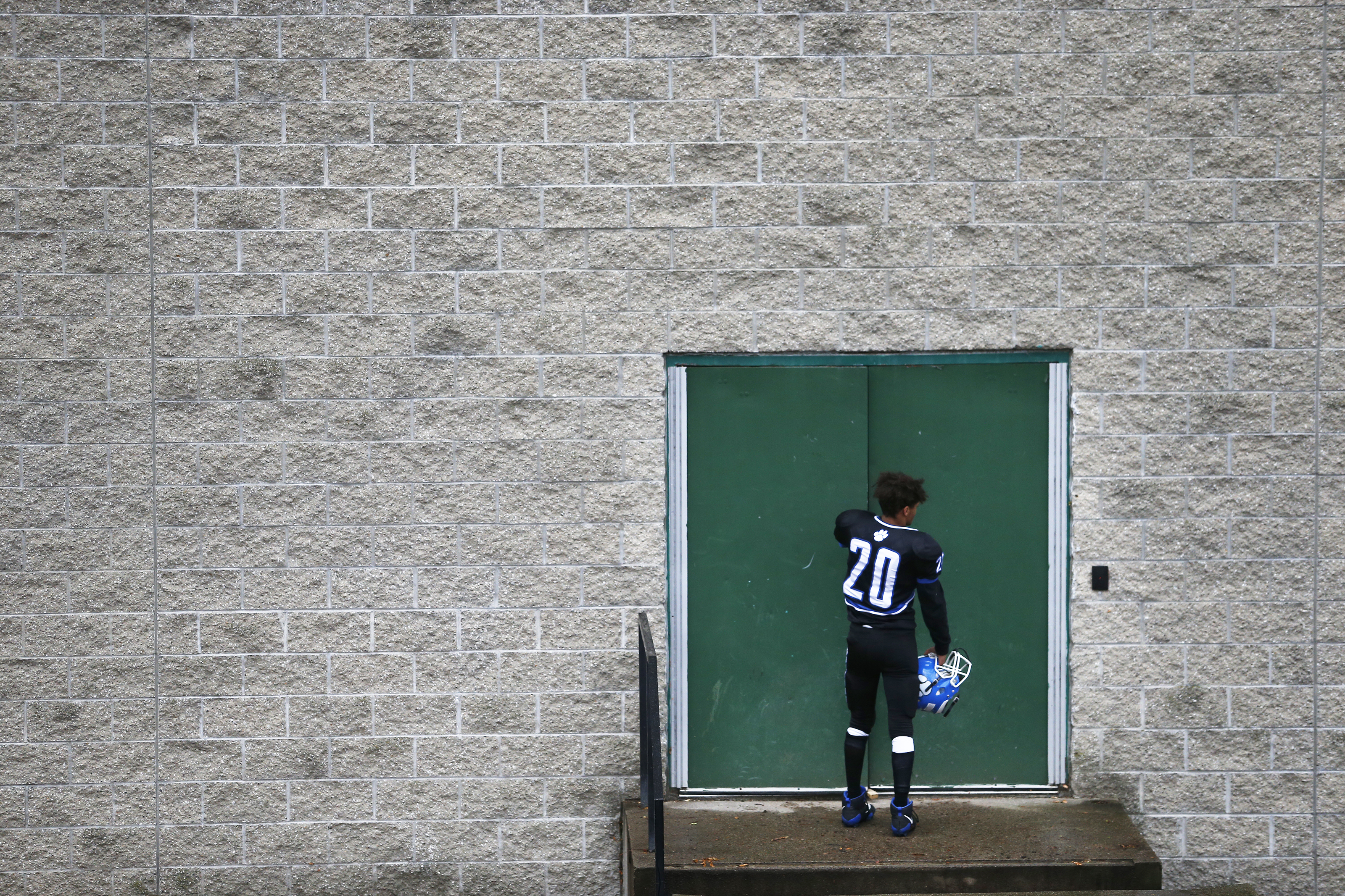 John D. O’Bryant player Nicholas Centeio headed back to the locker room after a 13-7 loss on Thanksgiving to Boston Latin Academy in the Boston City League North title game at Madison Park.