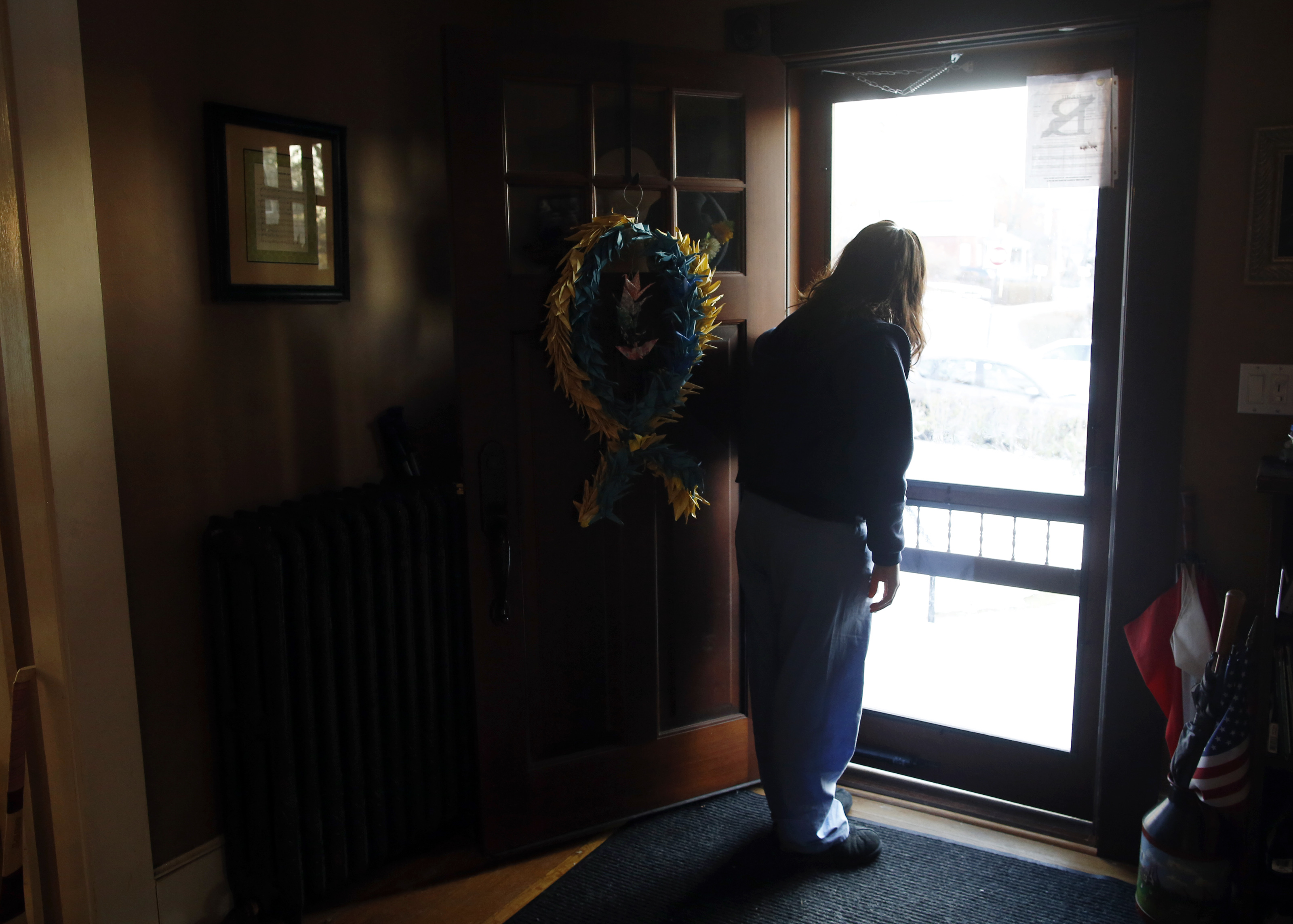 DEVASTATED BY THE ATTACK: Denise Richard lingered in the doorway as her son Henry headed off to school. The Richards have struggled with the death of Martin and their own injuries over the past year.