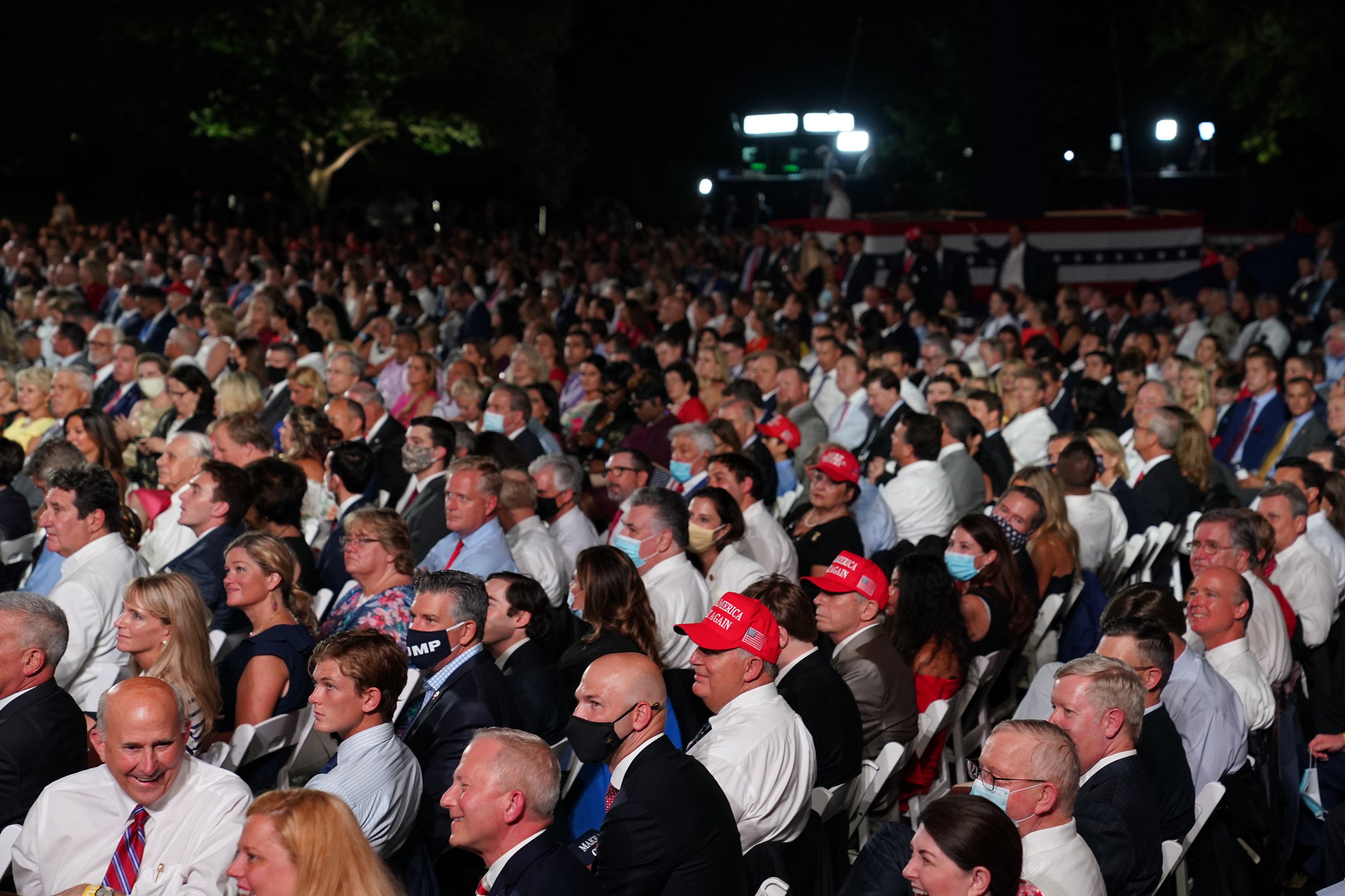 Rep. Louie Gohmert (R-Texas), bottom left, waited with other attendees to see President Trump accept the Republican presidential nomination.