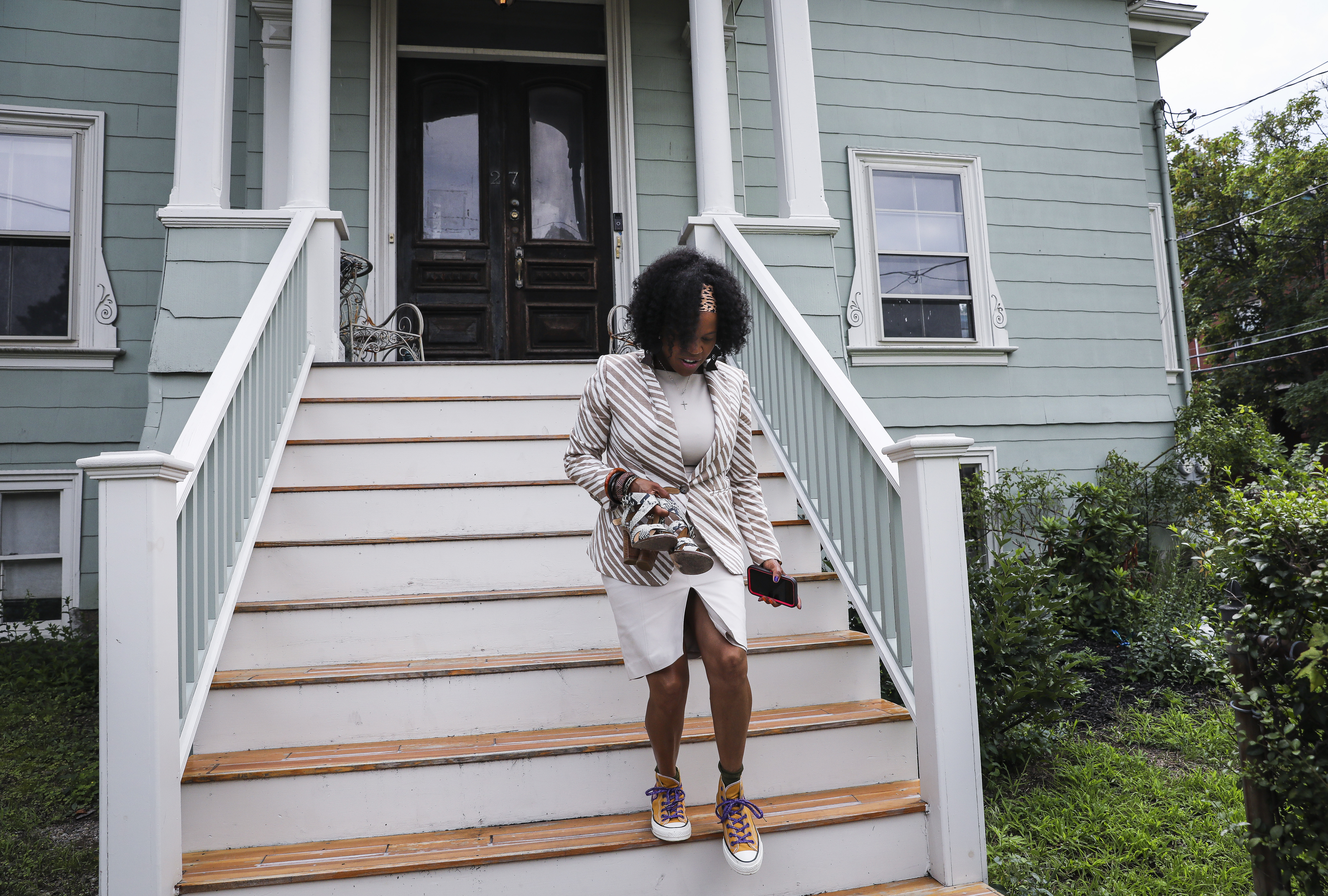 Acting Mayor Kim Janey walked down the steps of her 125-year-old Roxbury home as she prepared to go campaigning.