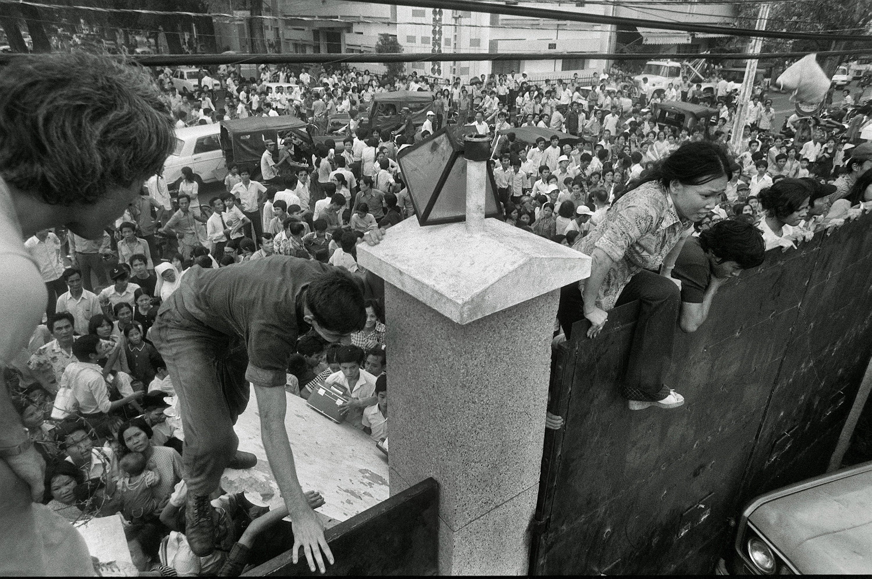 South Vietnamese civilians scaled the 14-foot wall of the US embassy in Saigon, trying to reach evacuation helicopters as the last Americans departed from Vietnam on April 29, 1975.