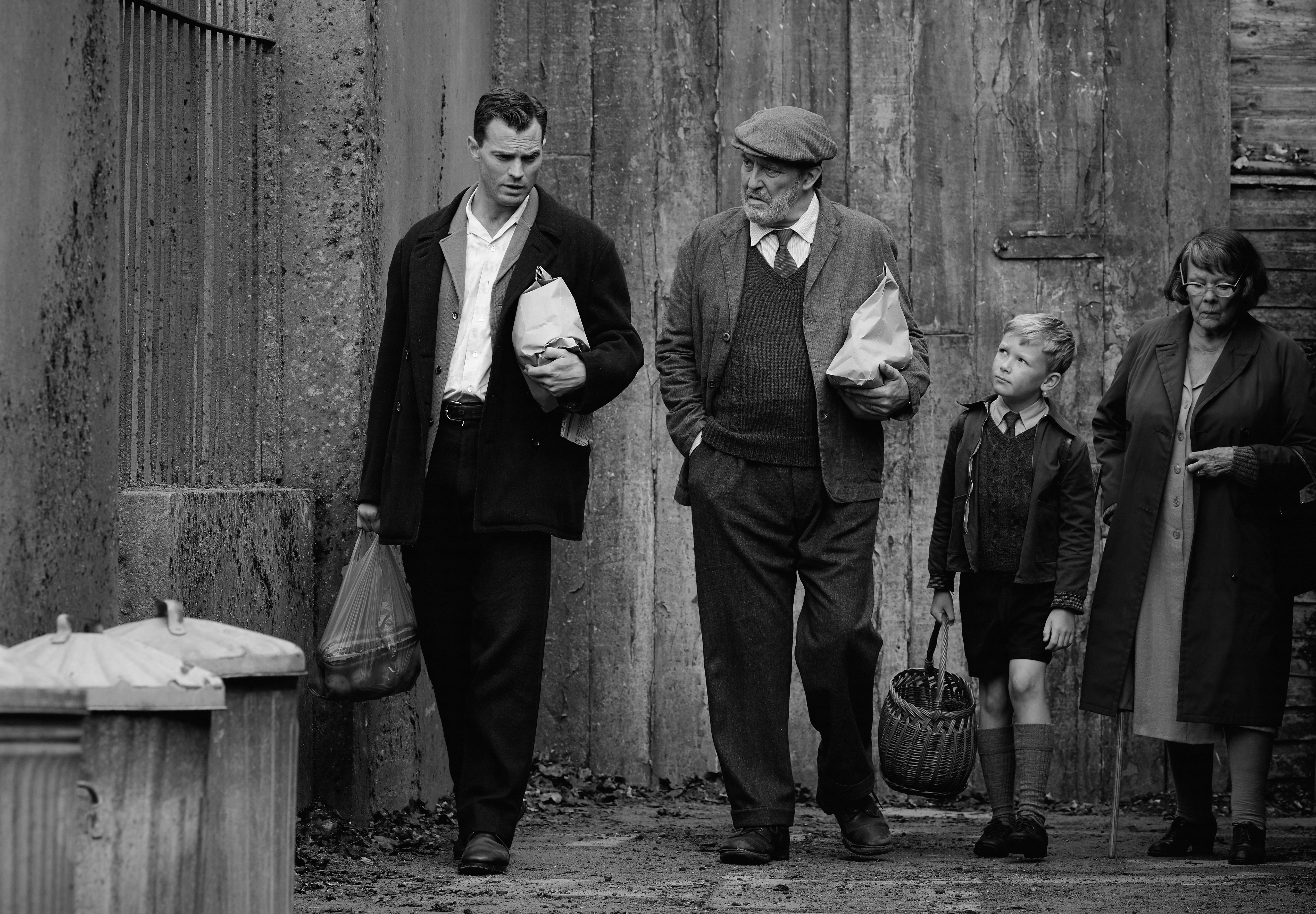 From left: Jamie Dornan, Ciarán Hinds, Jude Hill, and Judi Dench in "Belfast."
