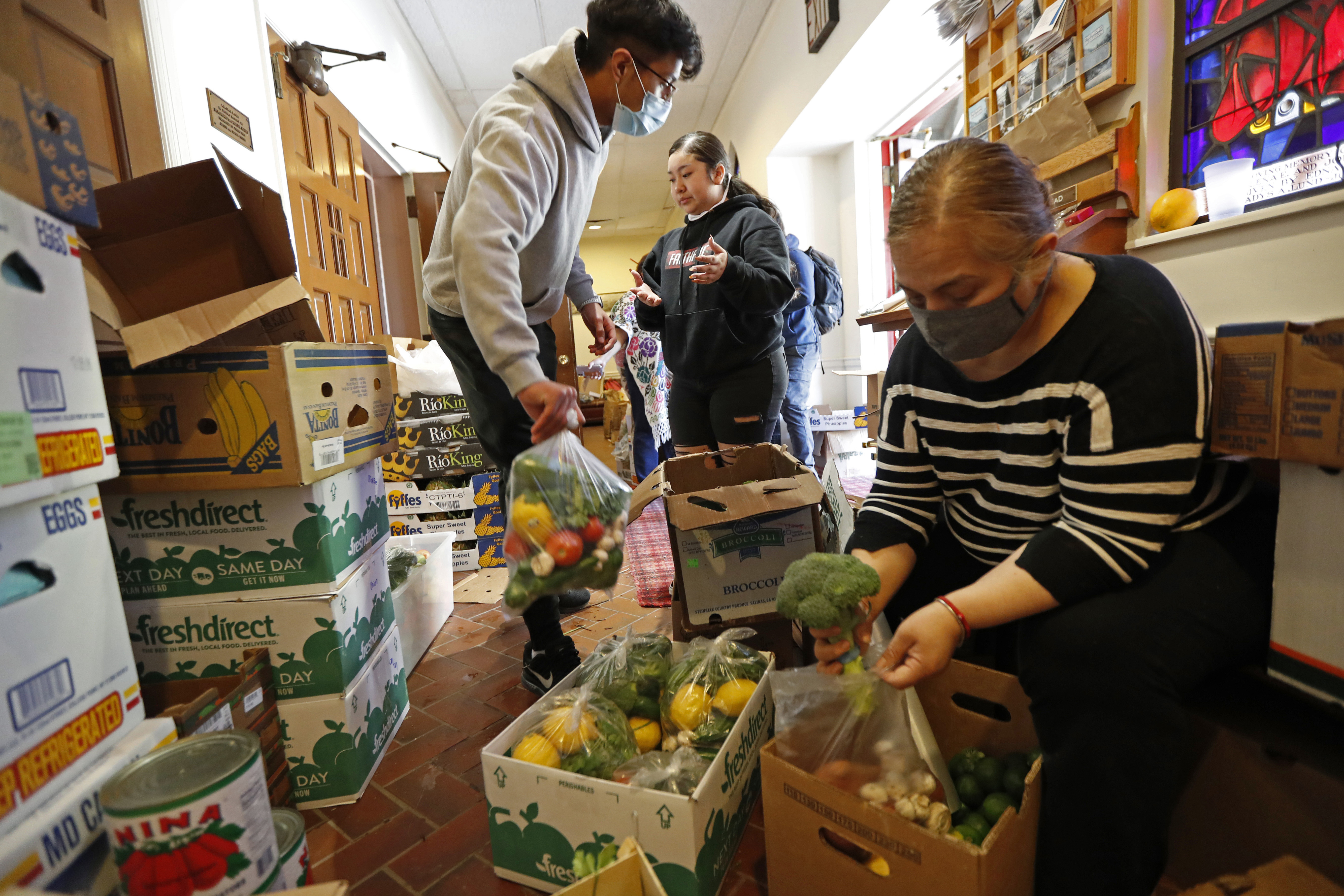 In a mutual aid effort that sprang up immediately after coronavirus-related shutdowns began, volunteers prepare food donations at the Lutheran Church of the Good Shepherd in Brooklyn in May 2020.