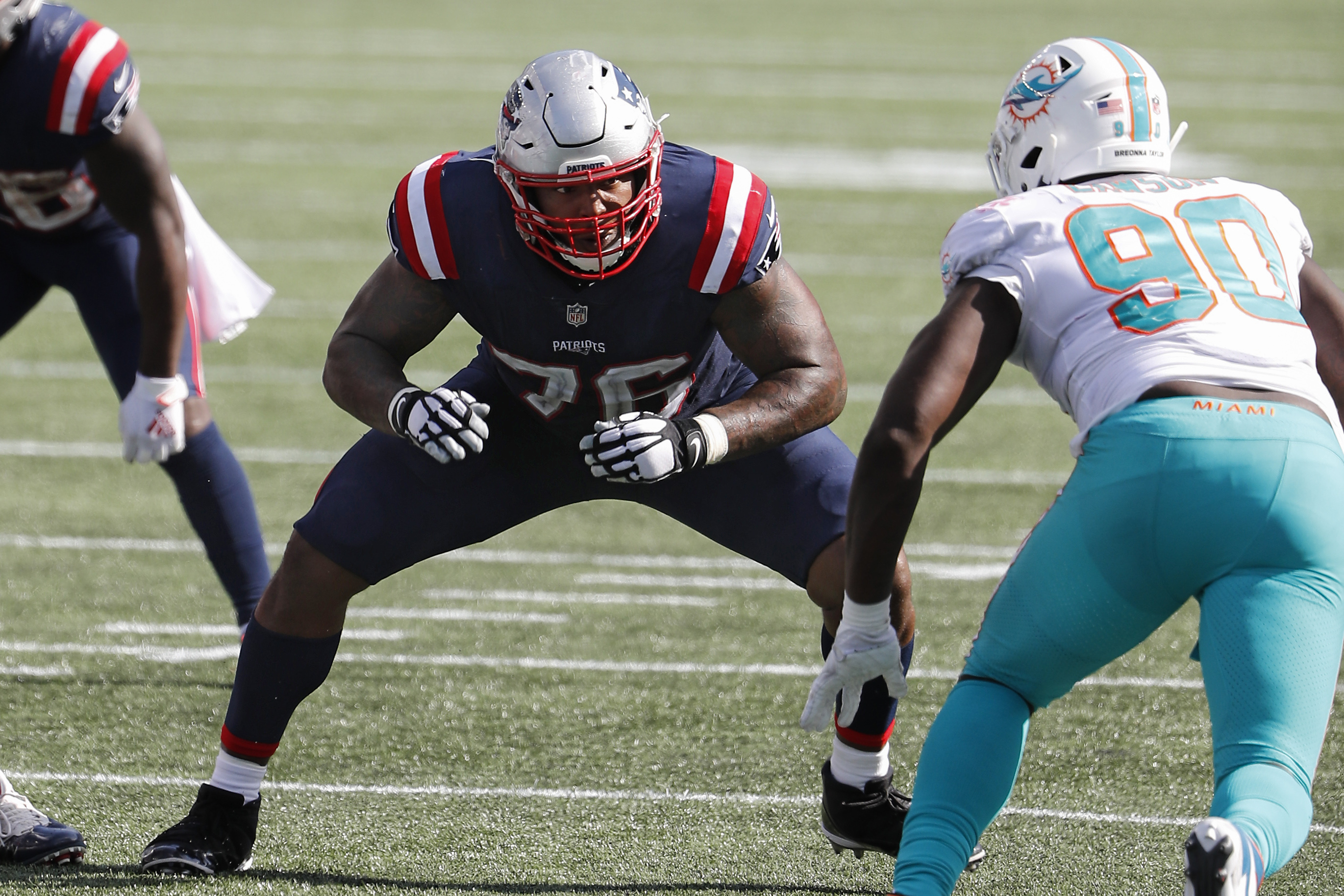 Isaiah Wynn blocks against the Dolphins in the regular-season opener earlier this month.