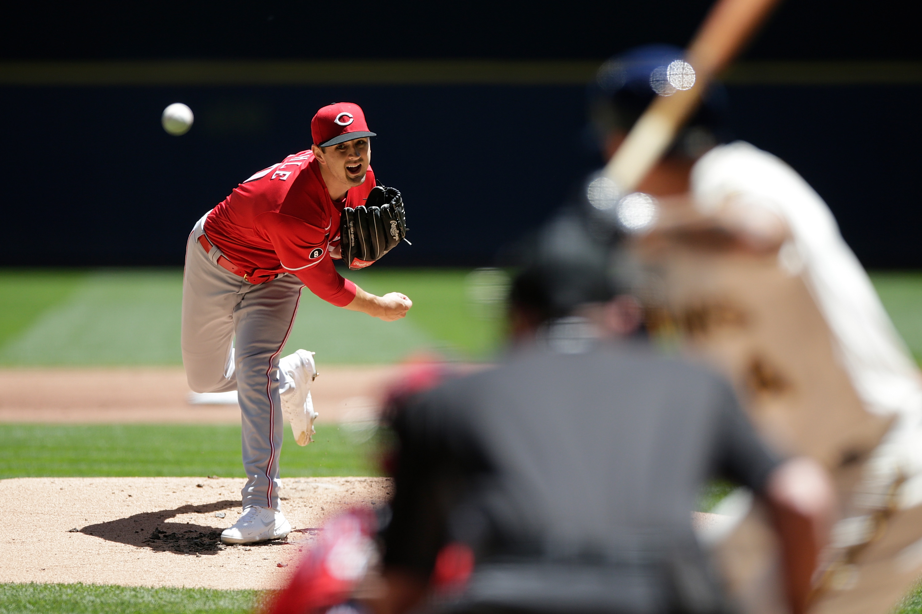 Mahle fans 12, Reds silence Brewers' bats again in 2-1 win