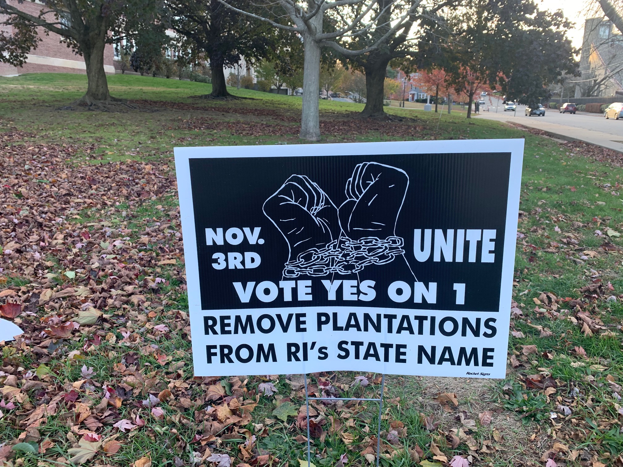 Lawn sign in Providence advocating for removing "Plantations" from the state's official name: Rhode Island and Providence Plantations