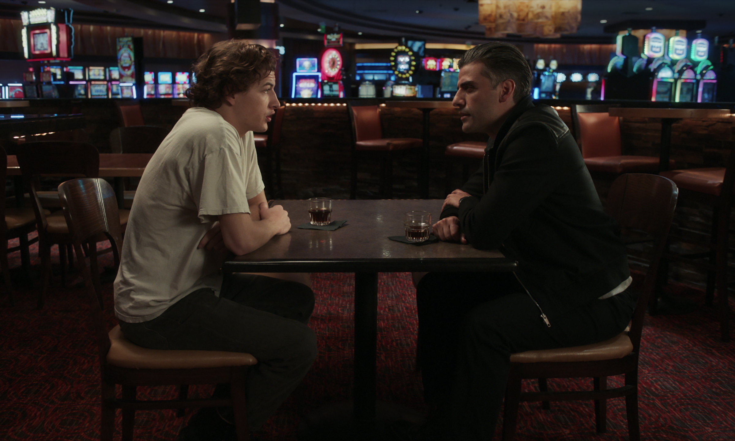 Tye Sheridan (left) and Oscar Isaac in "The Card Counter."