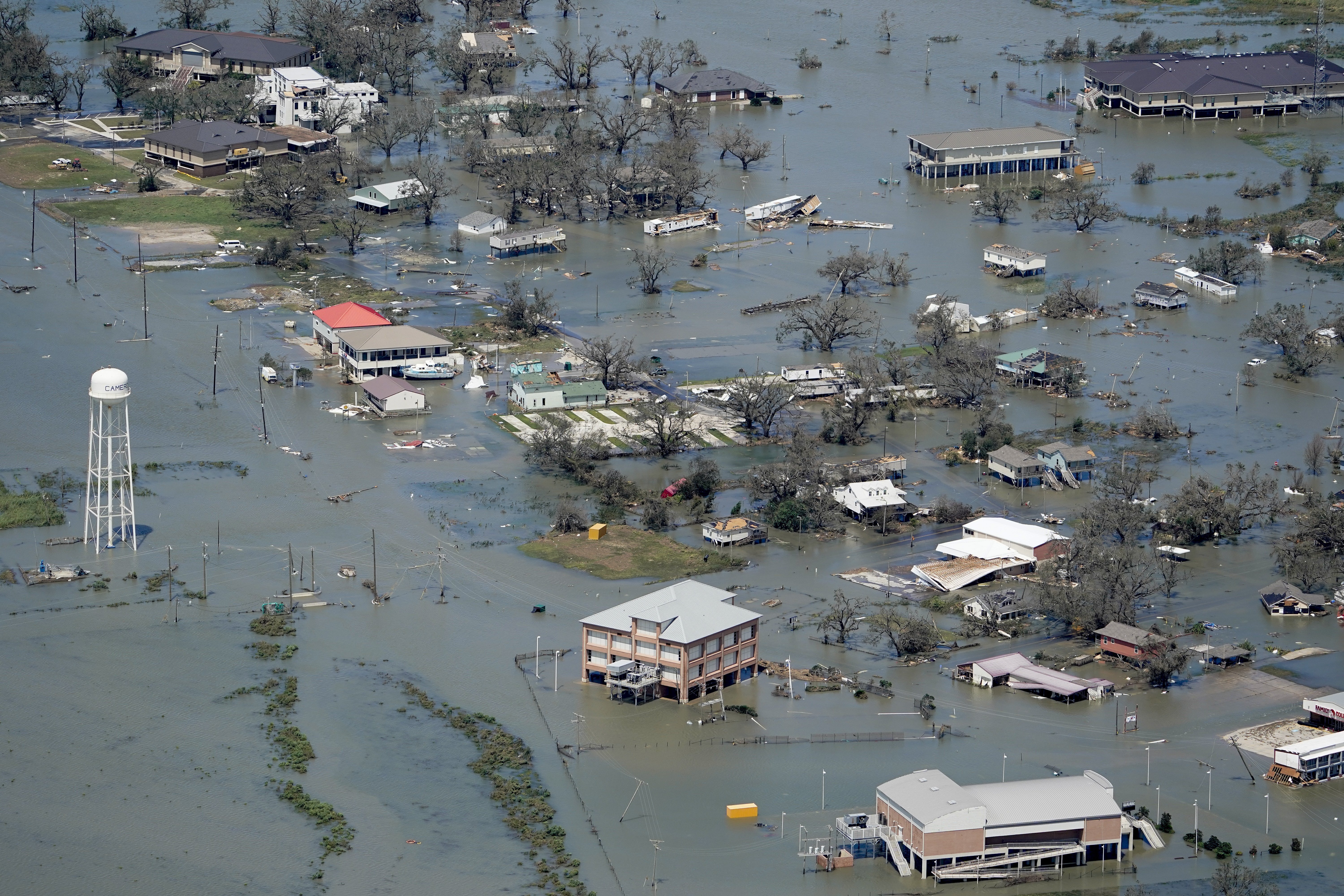 FILE - In this Aug. 27 photo, buildings and homes are flooded in the aftermath of Hurricane Laura near Lake Charles, La.