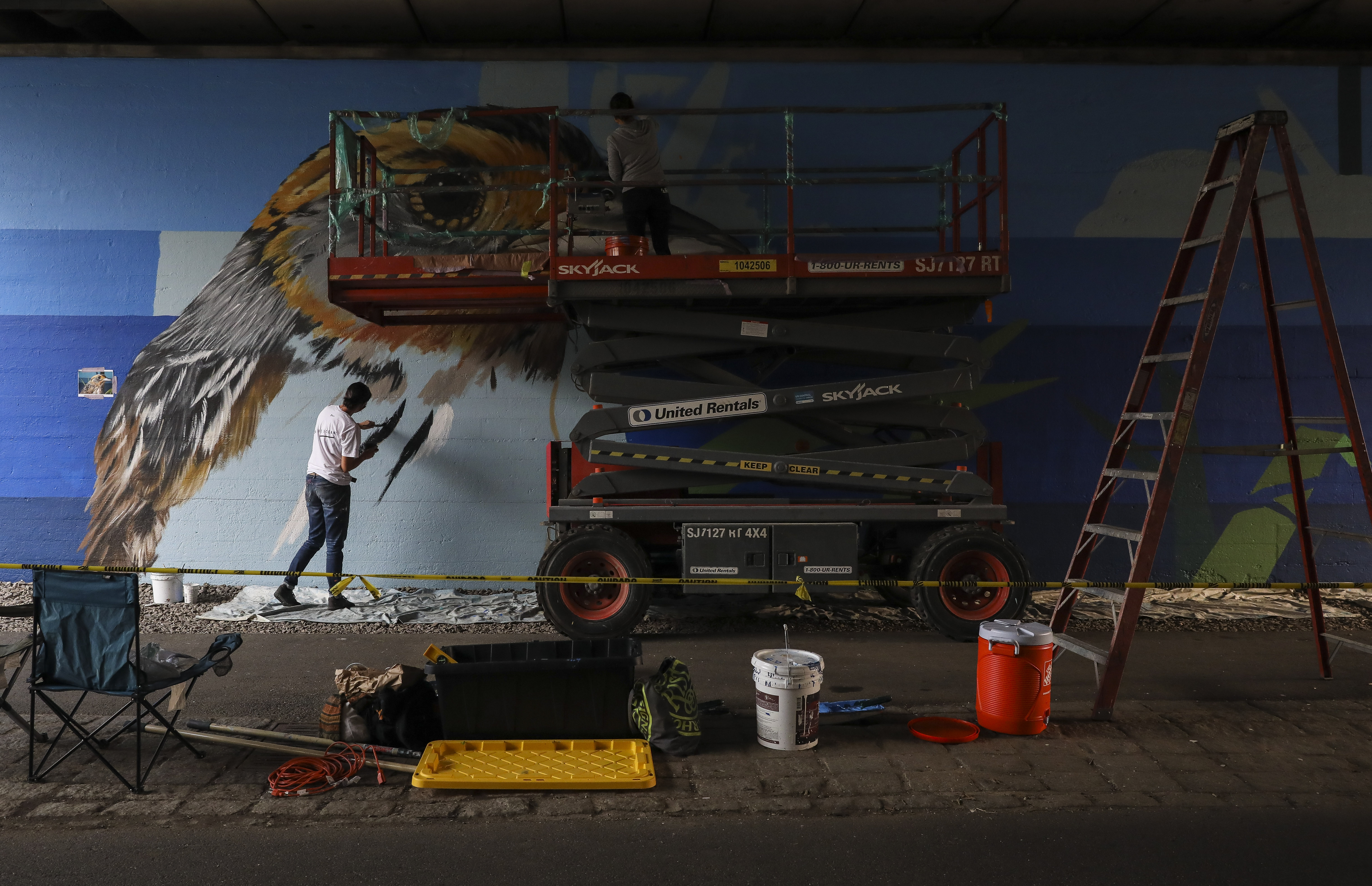 Sophy Tuttle, left, and Amanda Beard Garcia worked on a mural designed by Tuttle last week.