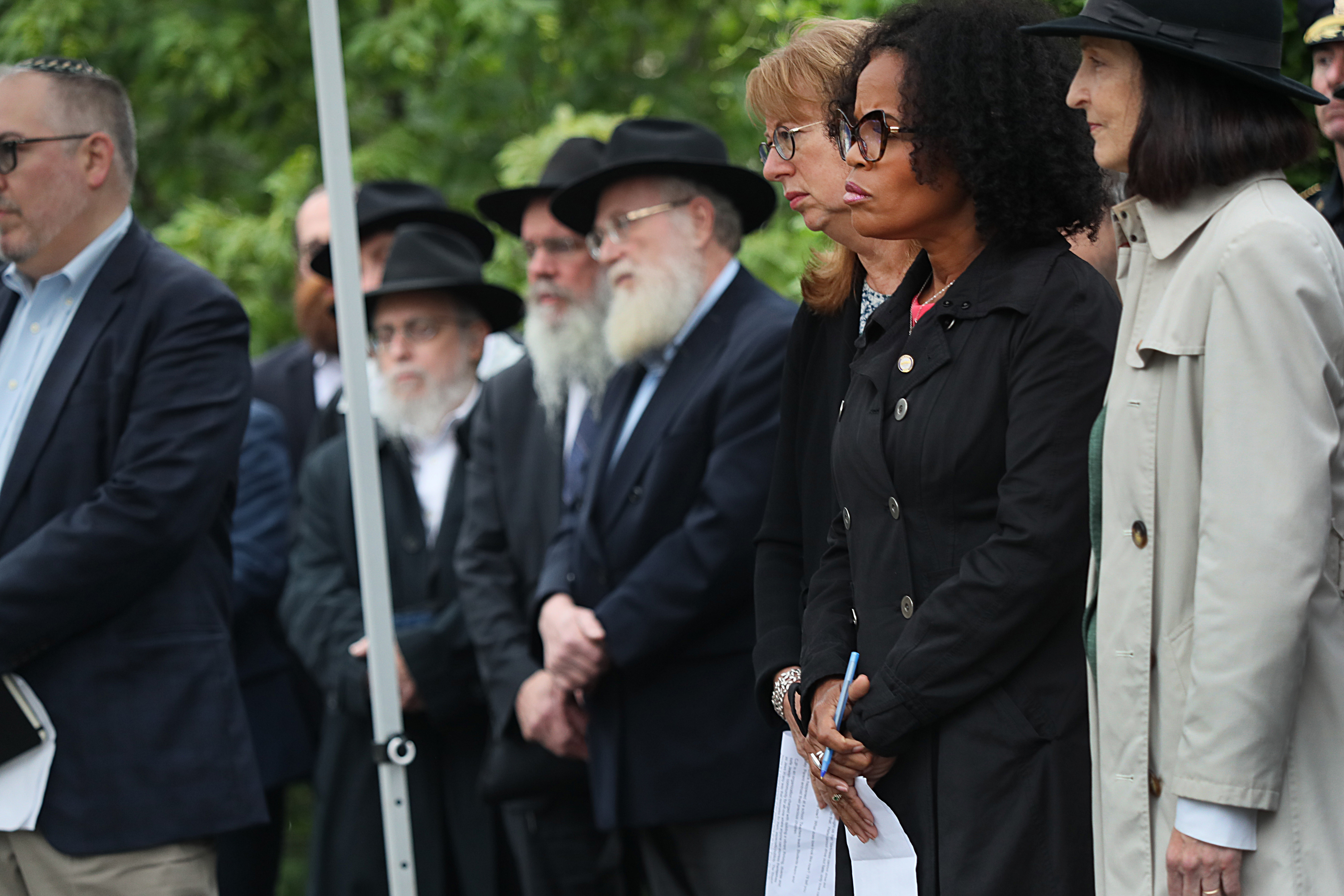 Many people, including Acting Mayor Kim Janey (second from right), attended a unity vigil on Brighton Common.