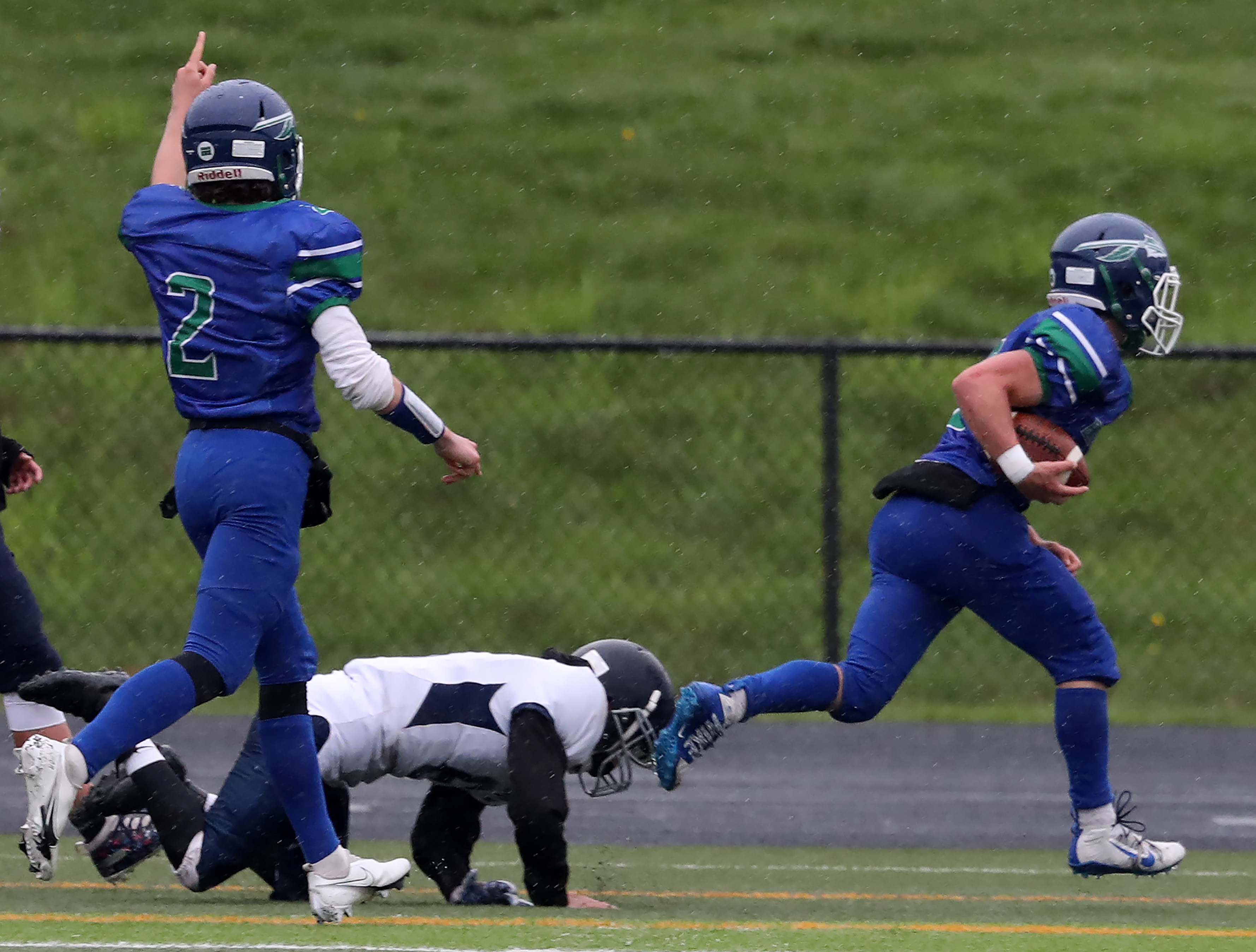 Anthony Graziano (2) celebrates as Blue Hills teammate Joe Fagan crosses the goal line for the first score of his five touchdowns Thursday afternoon against Bristol-Plymouth in Canton.