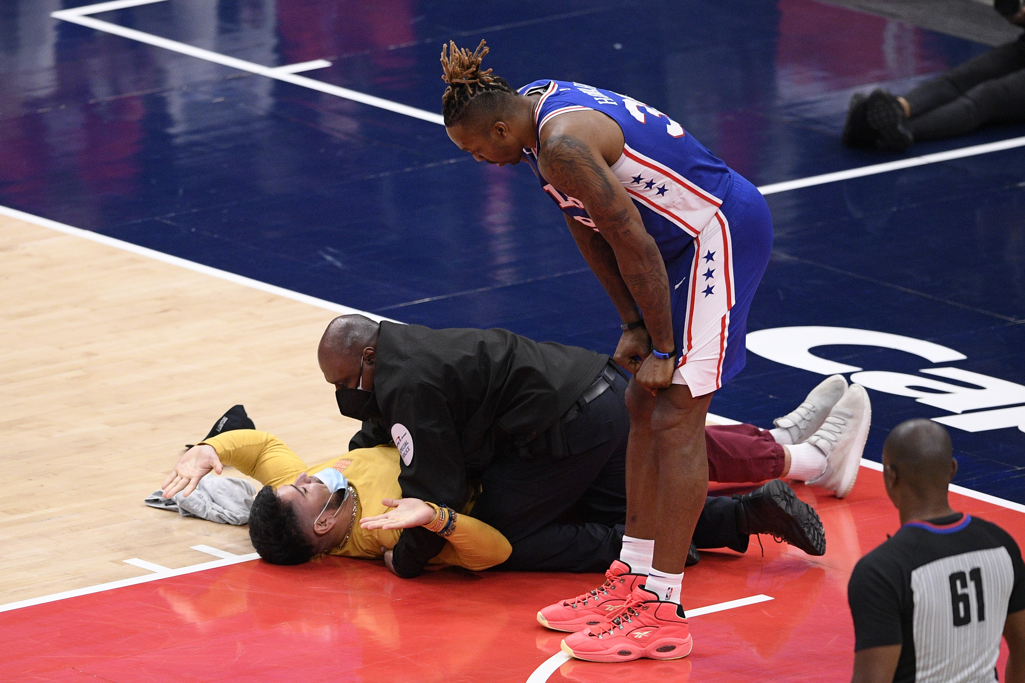 Fan runs on the floor during Wizards-Sixers playoff game in Washington - The Boston Globe
