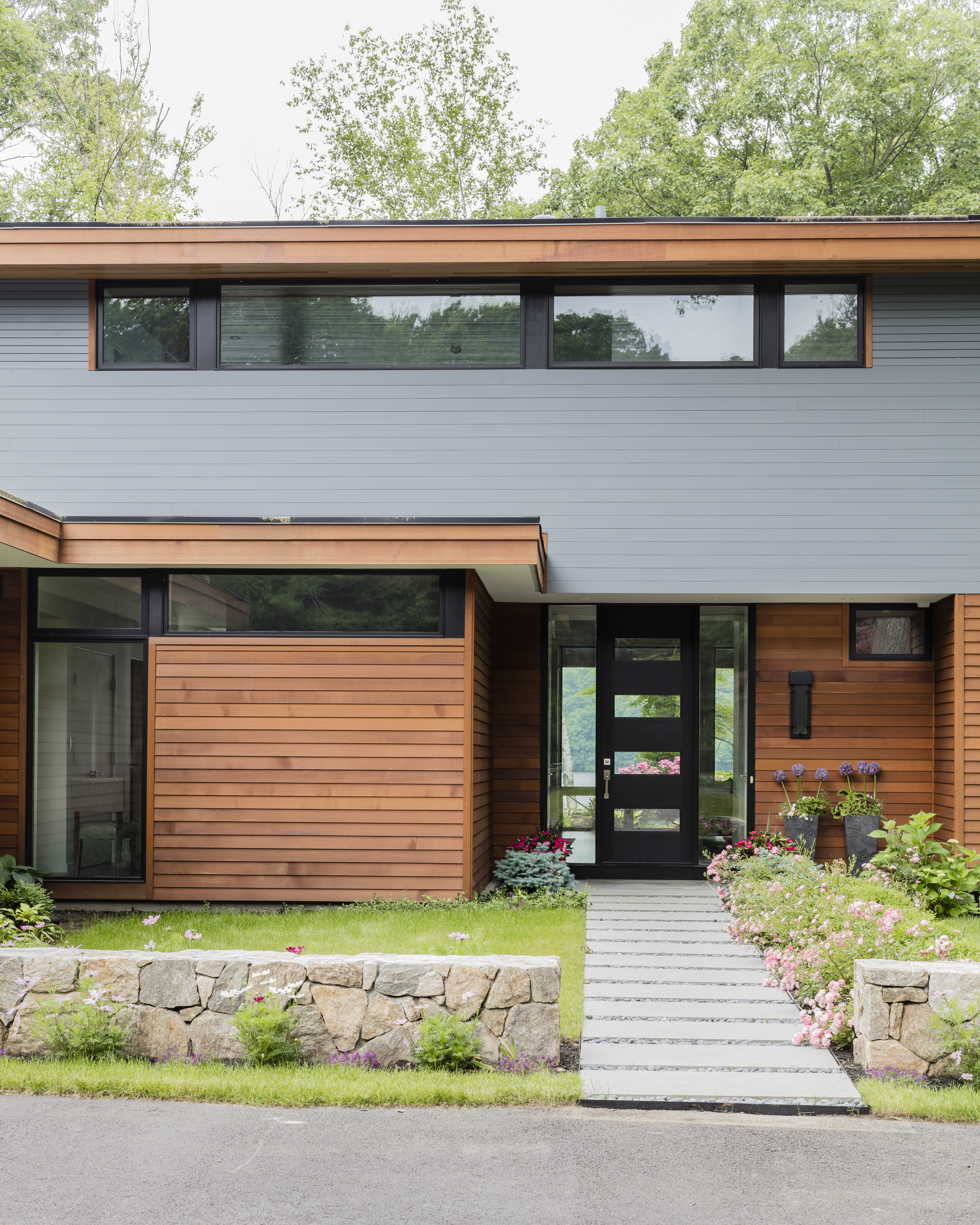 The home by Turkel Design was constructed on site from panelized components, a system that allows for predictability of quality, cost, and timing.