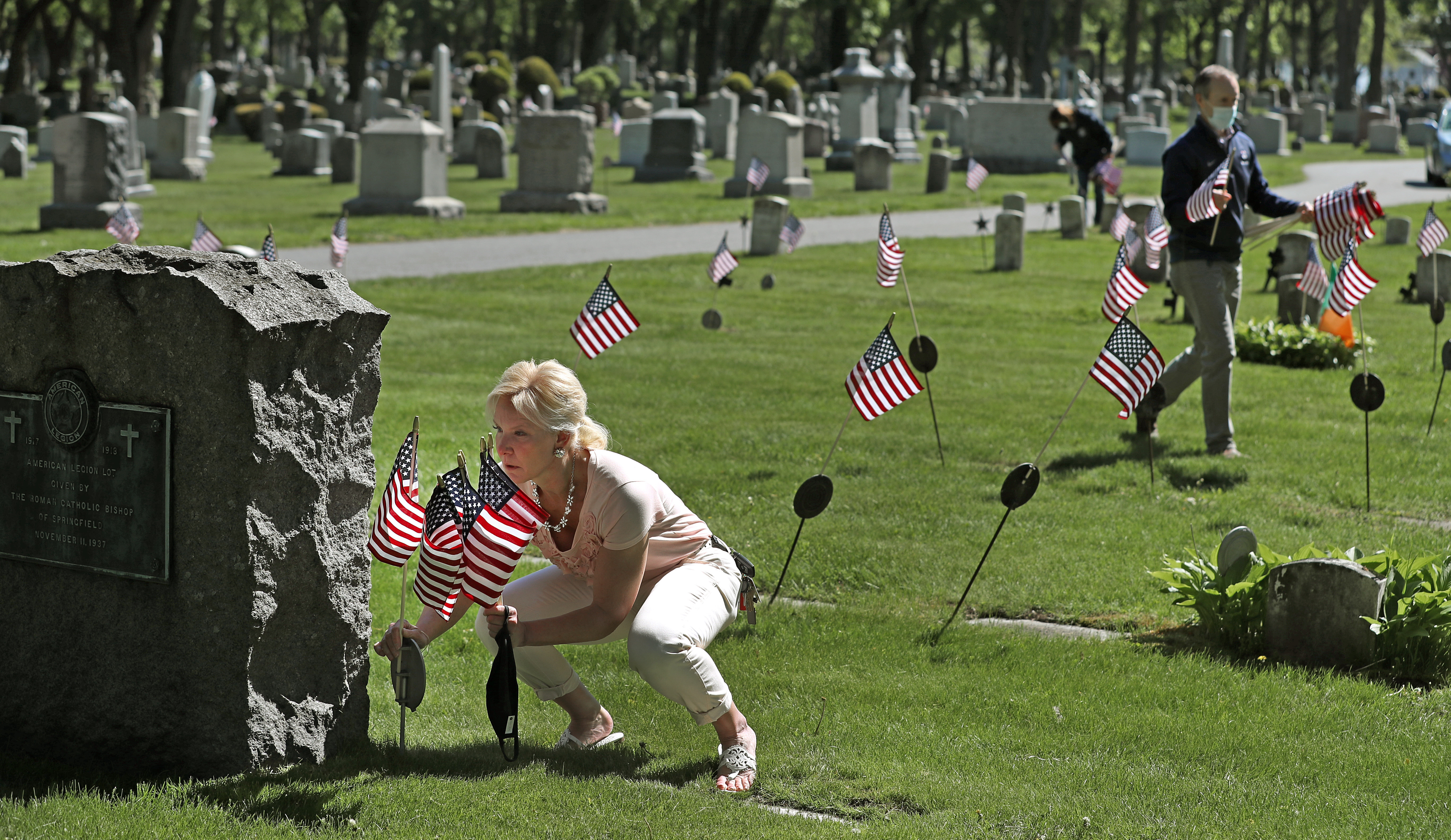 Some 4,000 flags were placed by volunteers at St. John's Cemetery in Worcester Wednesday morning.