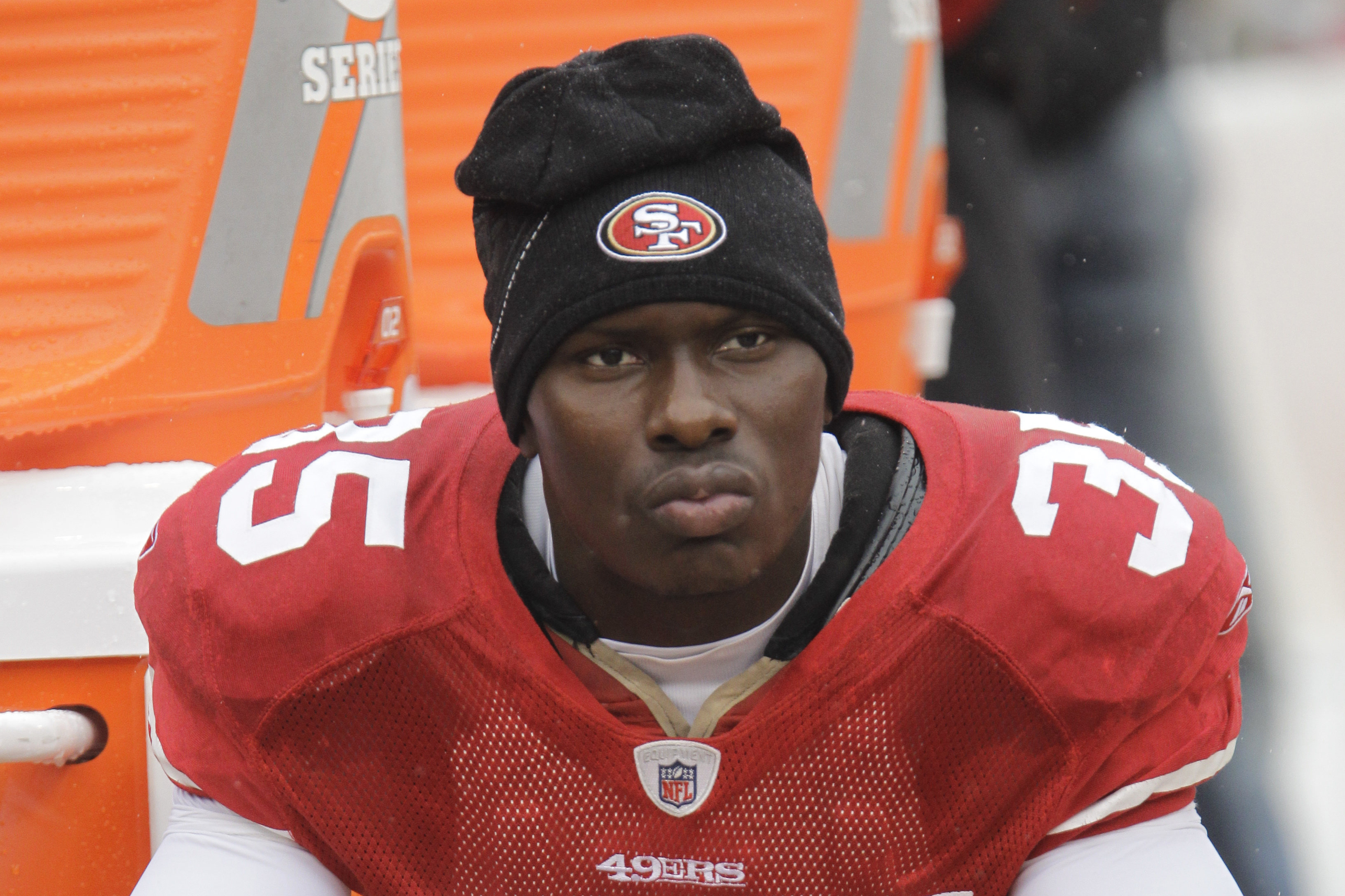 San Francisco 49ers cornerback Phillip Adams sat on the sideline during the first quarter of an NFL football game in San Francisco in 2010.