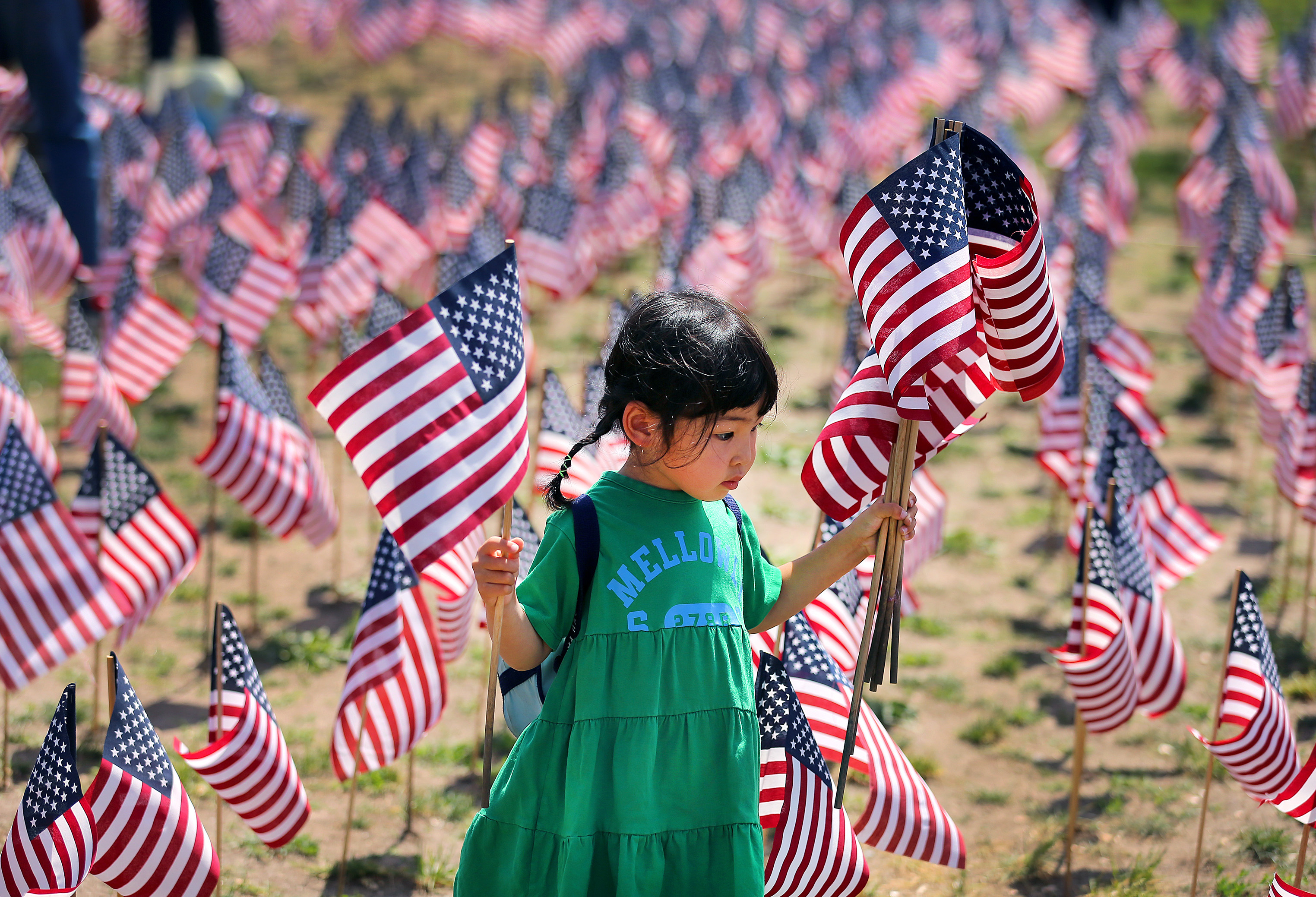 Volunteers plant over 37,000 US flags in Boston Common to remember