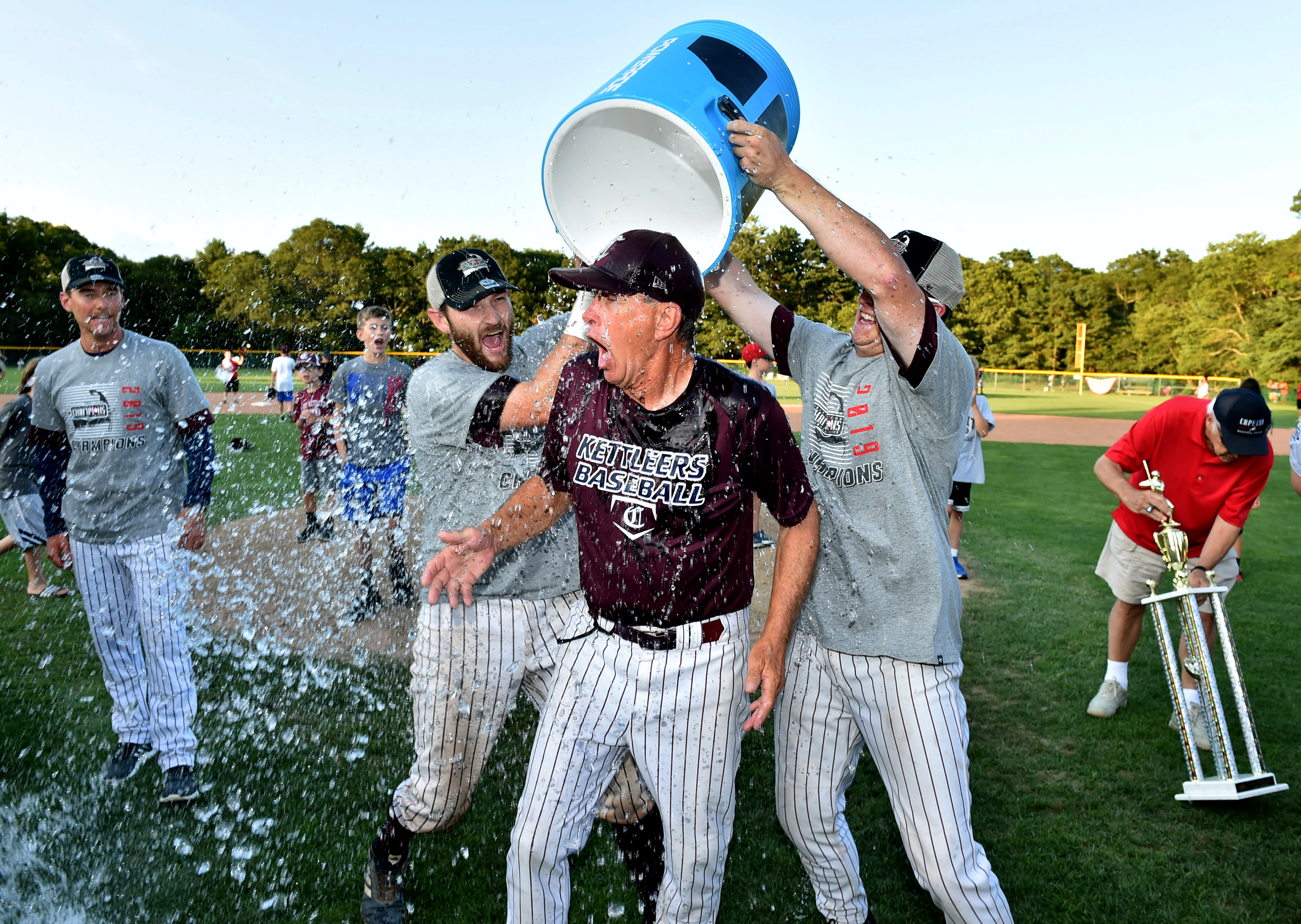 Volk snapped this shot of Cotuit manager Mike Roberts taking an ice water bath after winning the 2019 Cape League championship.