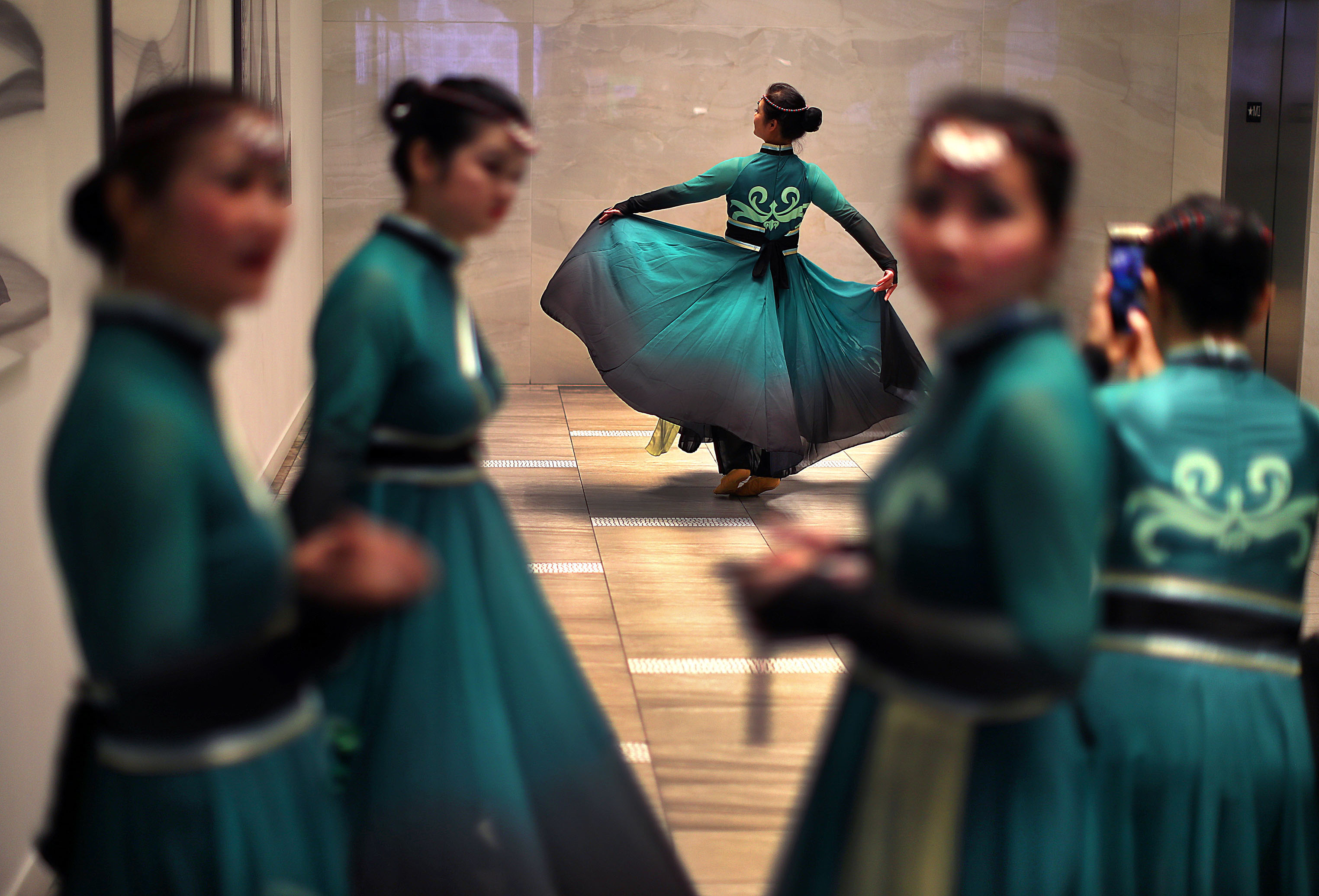 Boston’s First Night activities centered around Copley Square and dancers with the Chu Ling Dance Academy took turns practicing spins in the hallway while waiting to dance at the Copley Square Mall.