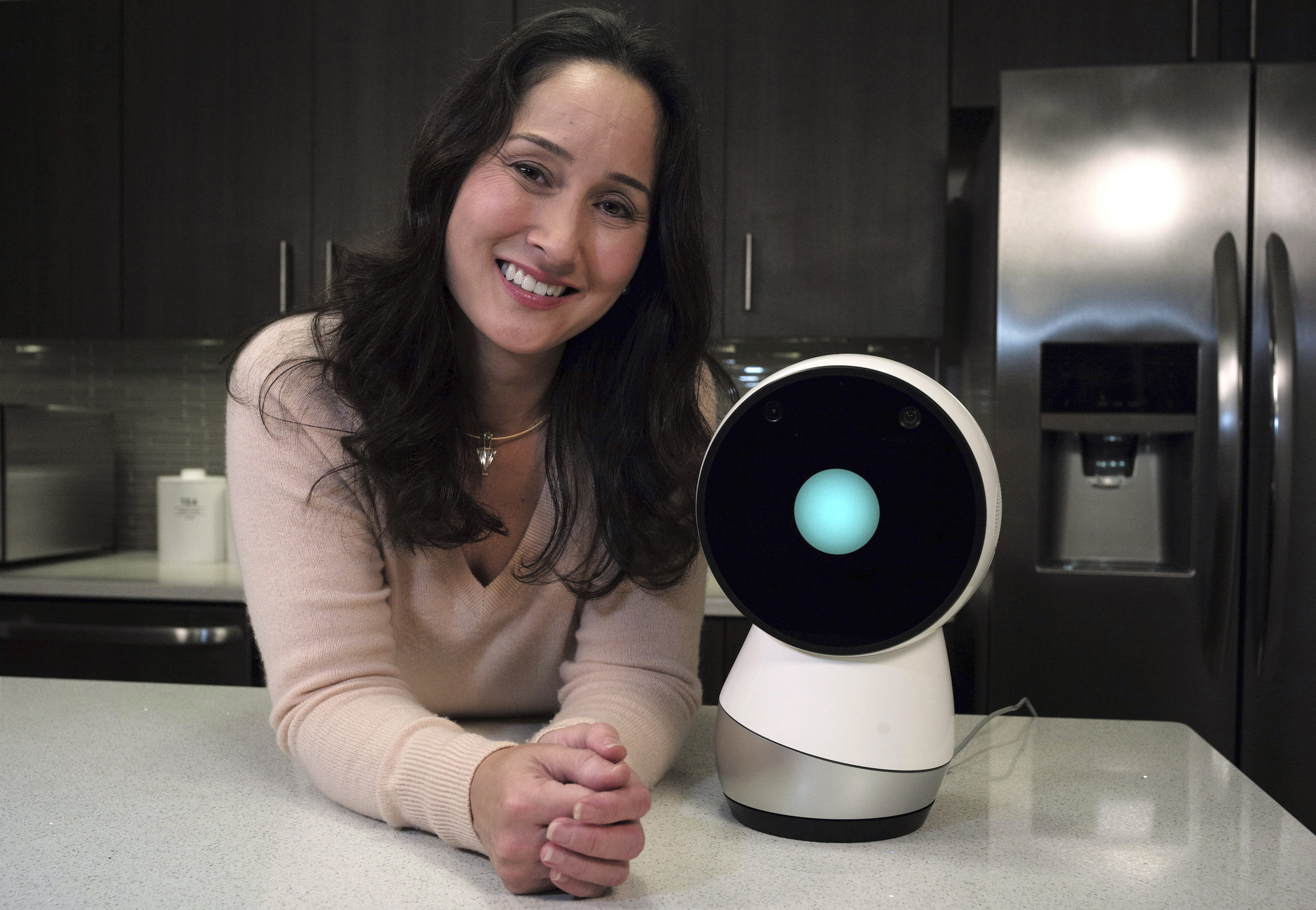 Cynthia Breazeal, head of the Personal Robots Group at the MIT Media Lab, next to Jibo.