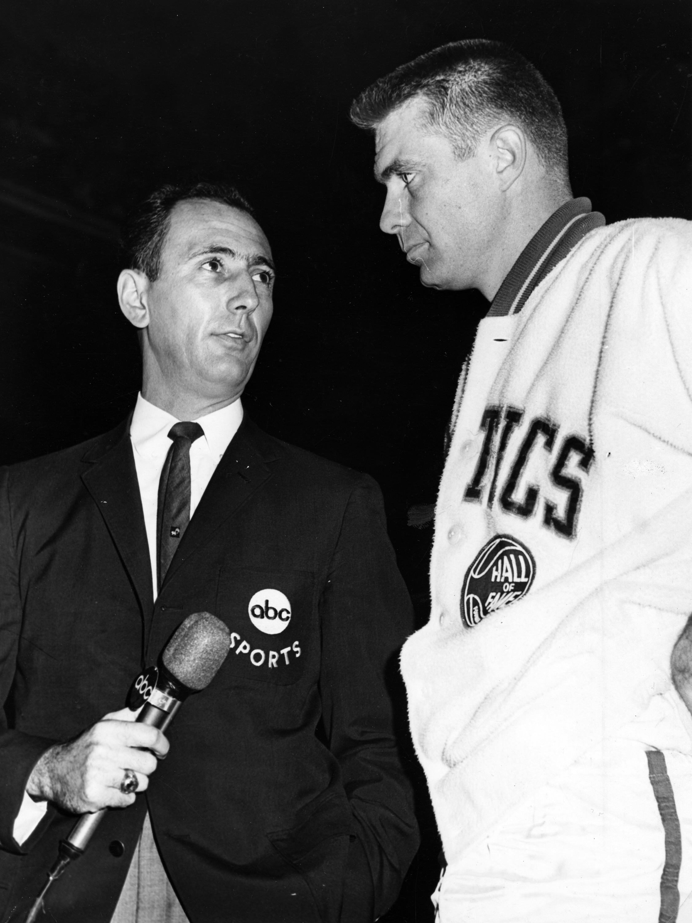 Bob Cousy interviews Tom Heinsohn before a 1965 game.
