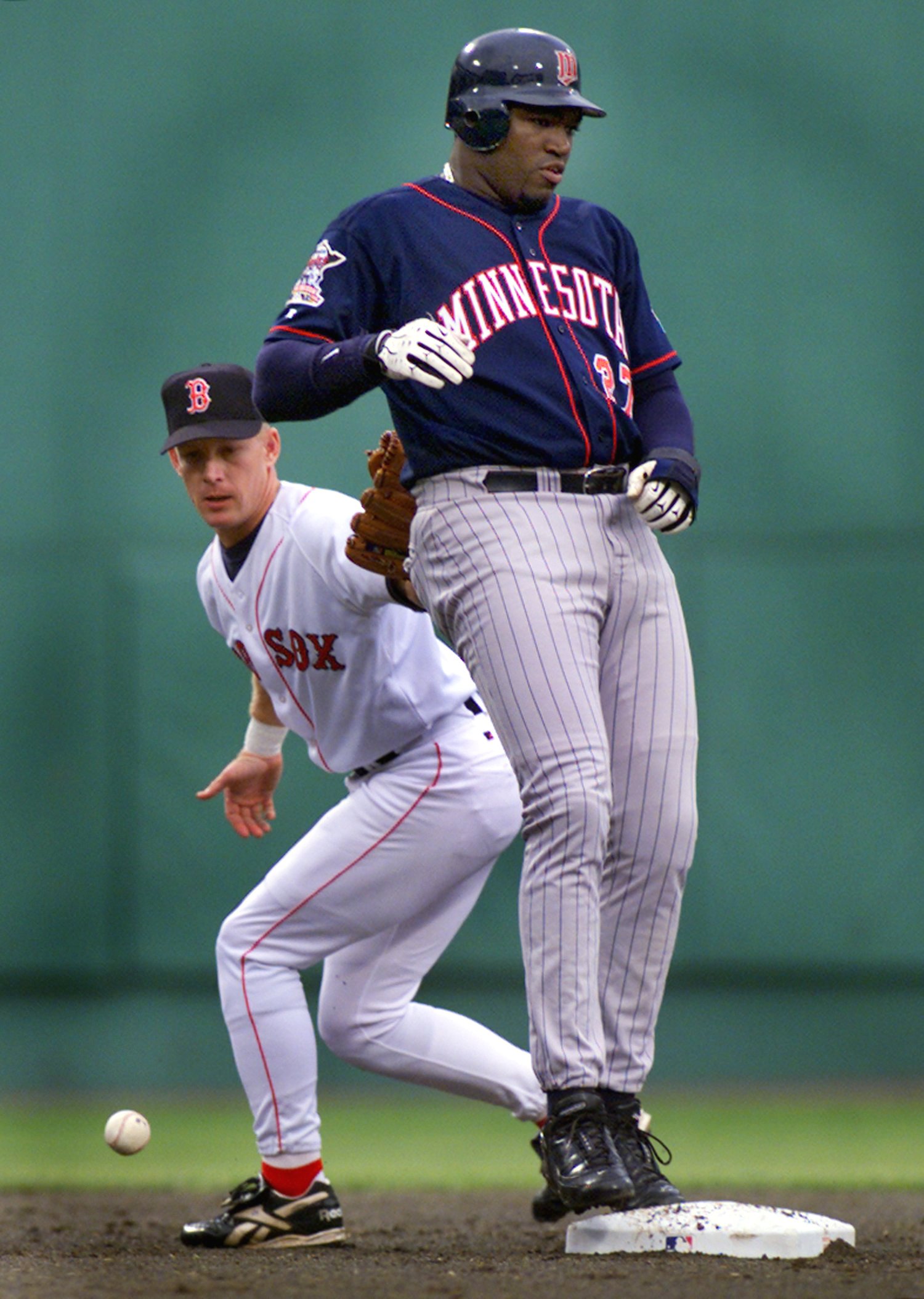 During a 2000 game, Red Sox second baseman Jeff Frye loses the ball while trying to lay a tag on Ortiz.