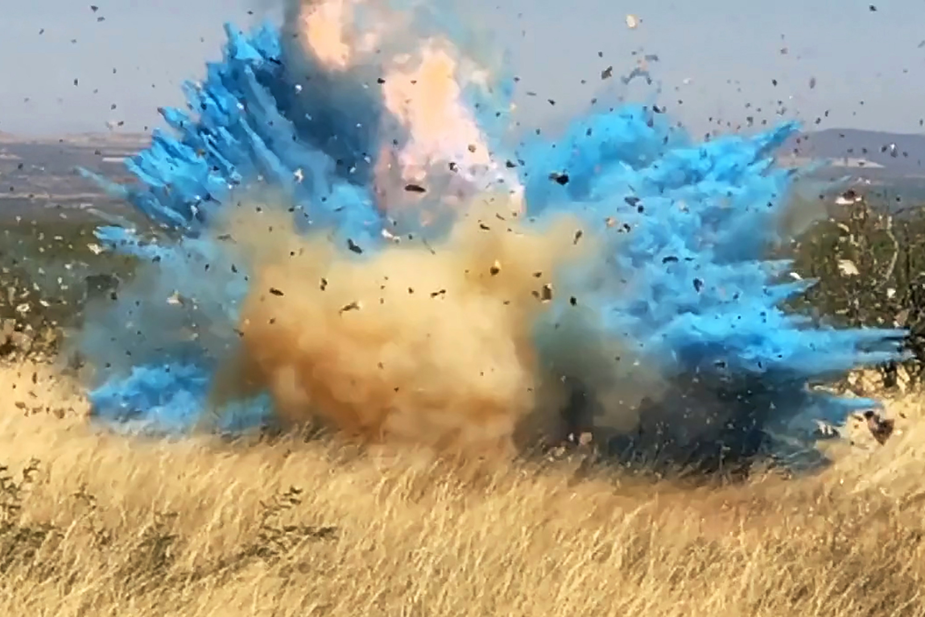 A photo from a video provided by the US Forest Service showed a gender reveal event in the Santa Rita Mountains' foothills, southeast of Tucson, Ariz. The explosion from the reveal ignited the 47,000-acre Sawmill Fire.
