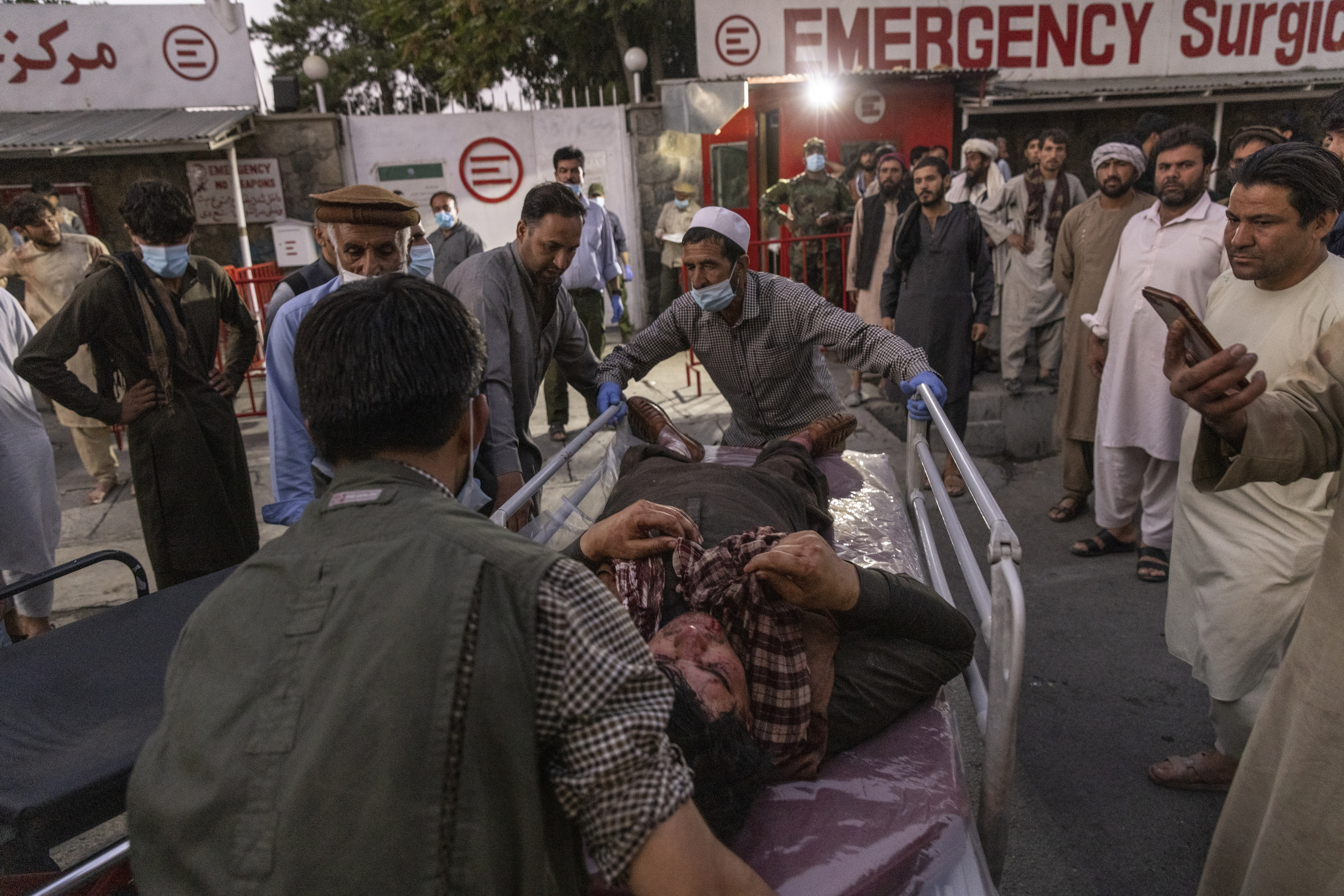 A person wounded in a bomb blast outside the Kabul airport in Afghanistan on Aug. 26 arrived at a hospital.