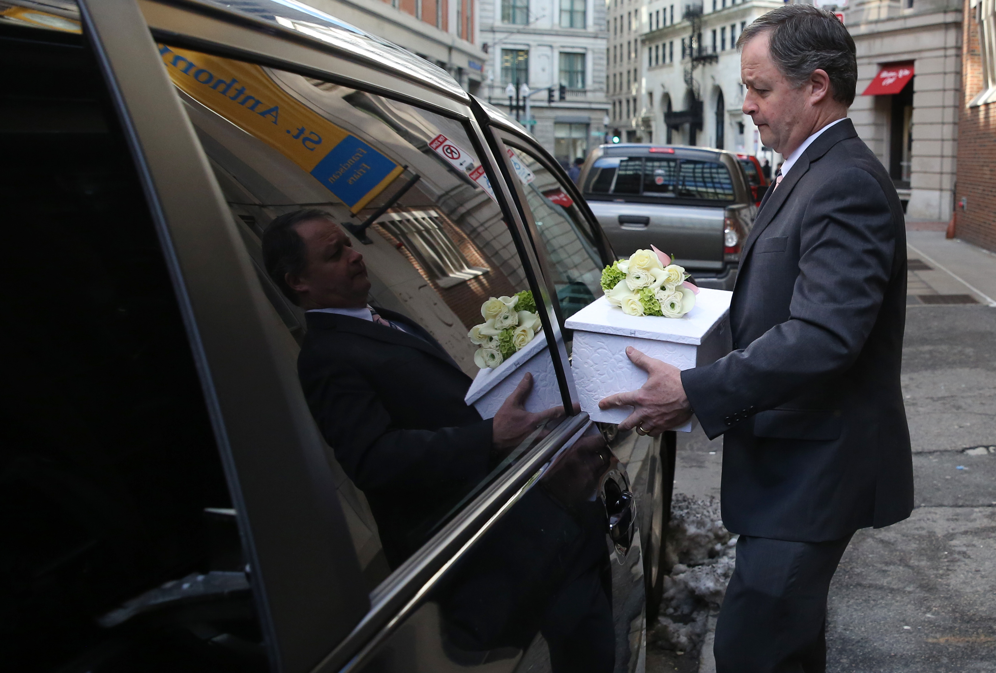 Funeral Director Jed Dolan carried Angela’s casket to his car after the funeral.