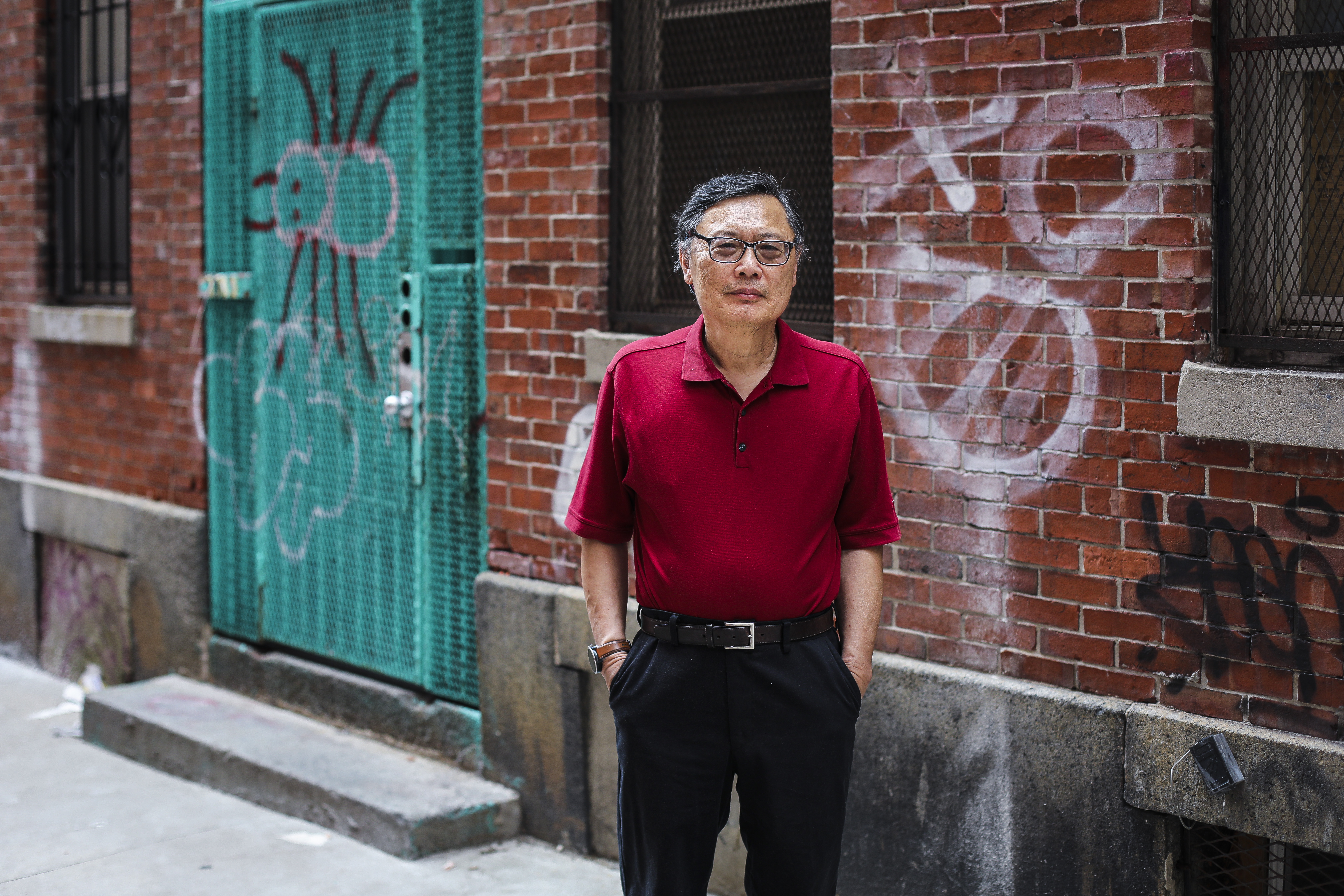 Historian Michael Liu, author of "Forever Struggle: Activism, Identity, and Survival in Boston's Chinatown, 1880-2018," outiside Oxford Place in Chinatown.