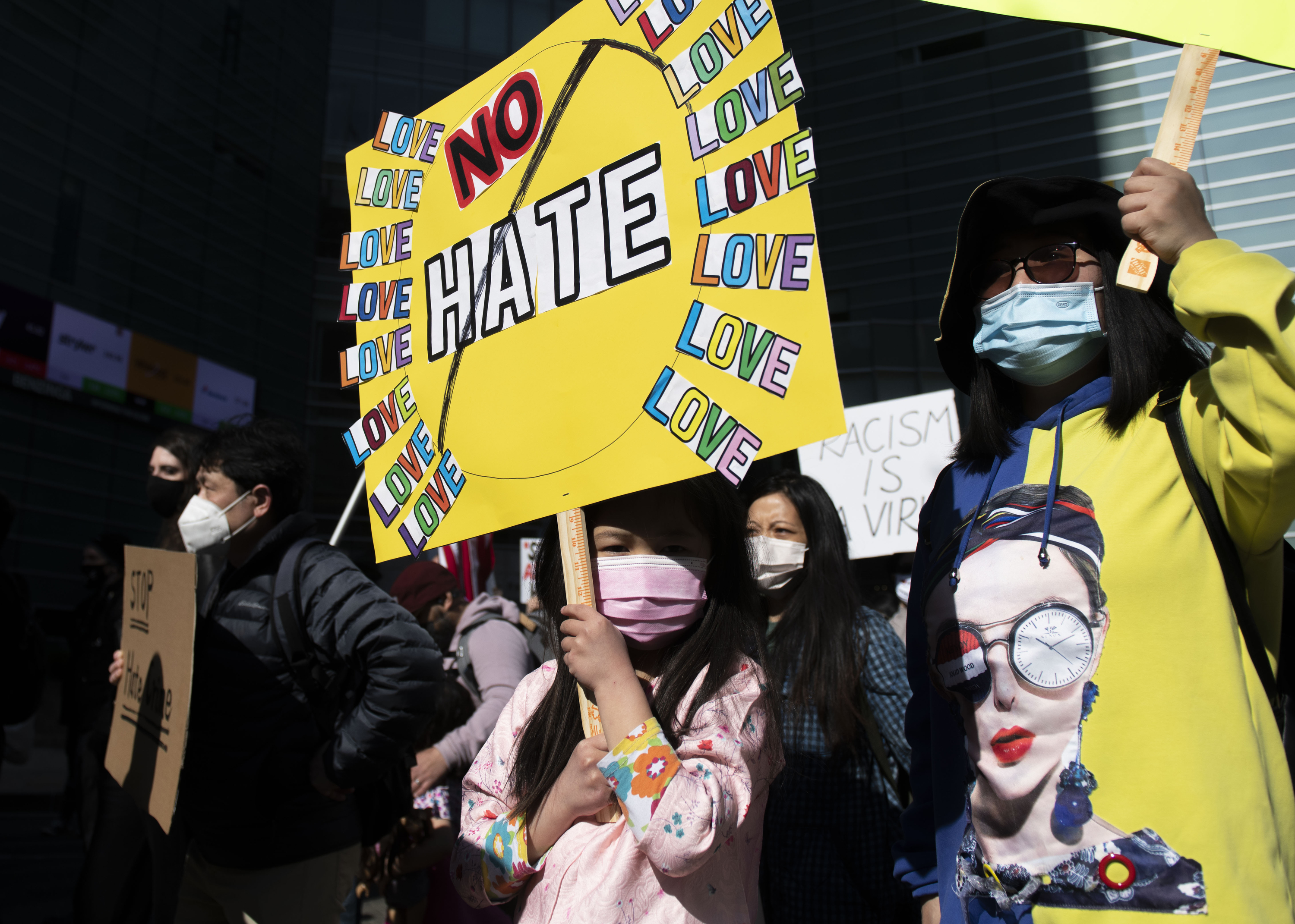 Phoebe Yang, 6, marched alongside Xuemei Li during the second consecutive weekend of Stop Asian Hate protests in Detroit on March 27.