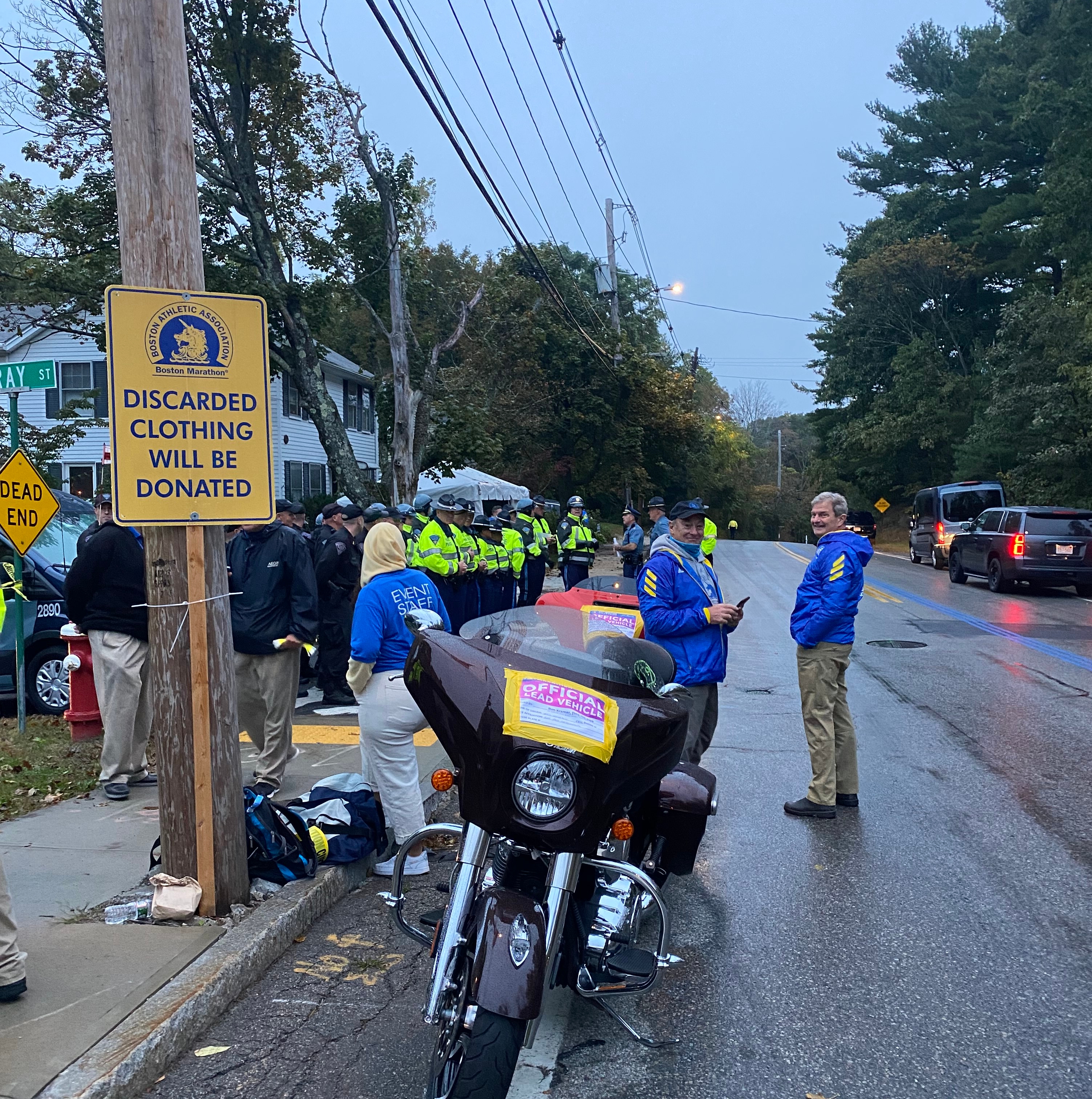 State troopers line up near the starting line to go over the game plan for the first Boston Marathon held outside of its traditional Patriots’ Day start.
