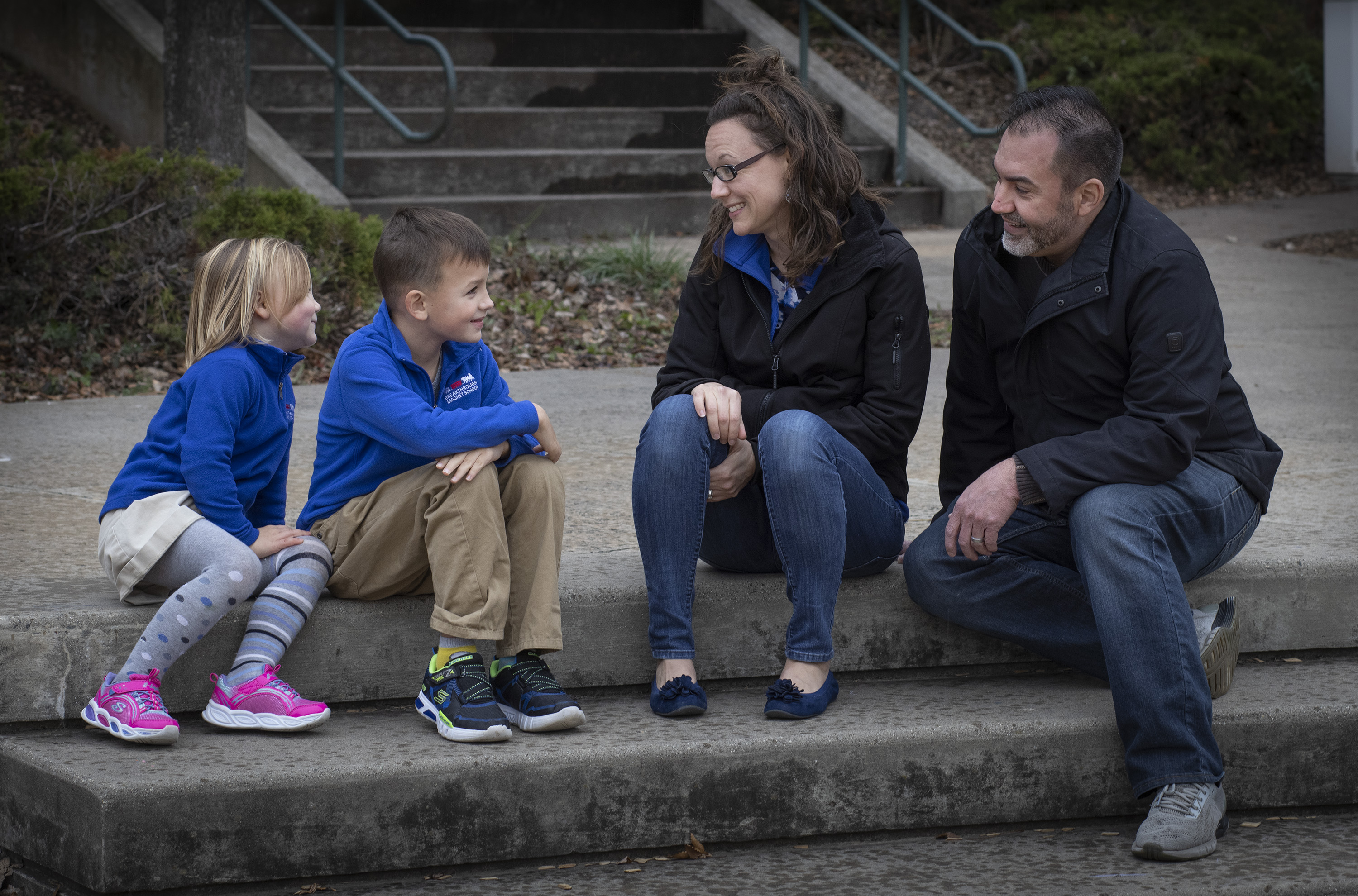 Meredith (center right) and Chris (right) Dresko and their two children Gabriel, 7, (center left) and Kiara, 5, (left) at the Breakthrough Magnet School in Hartford.