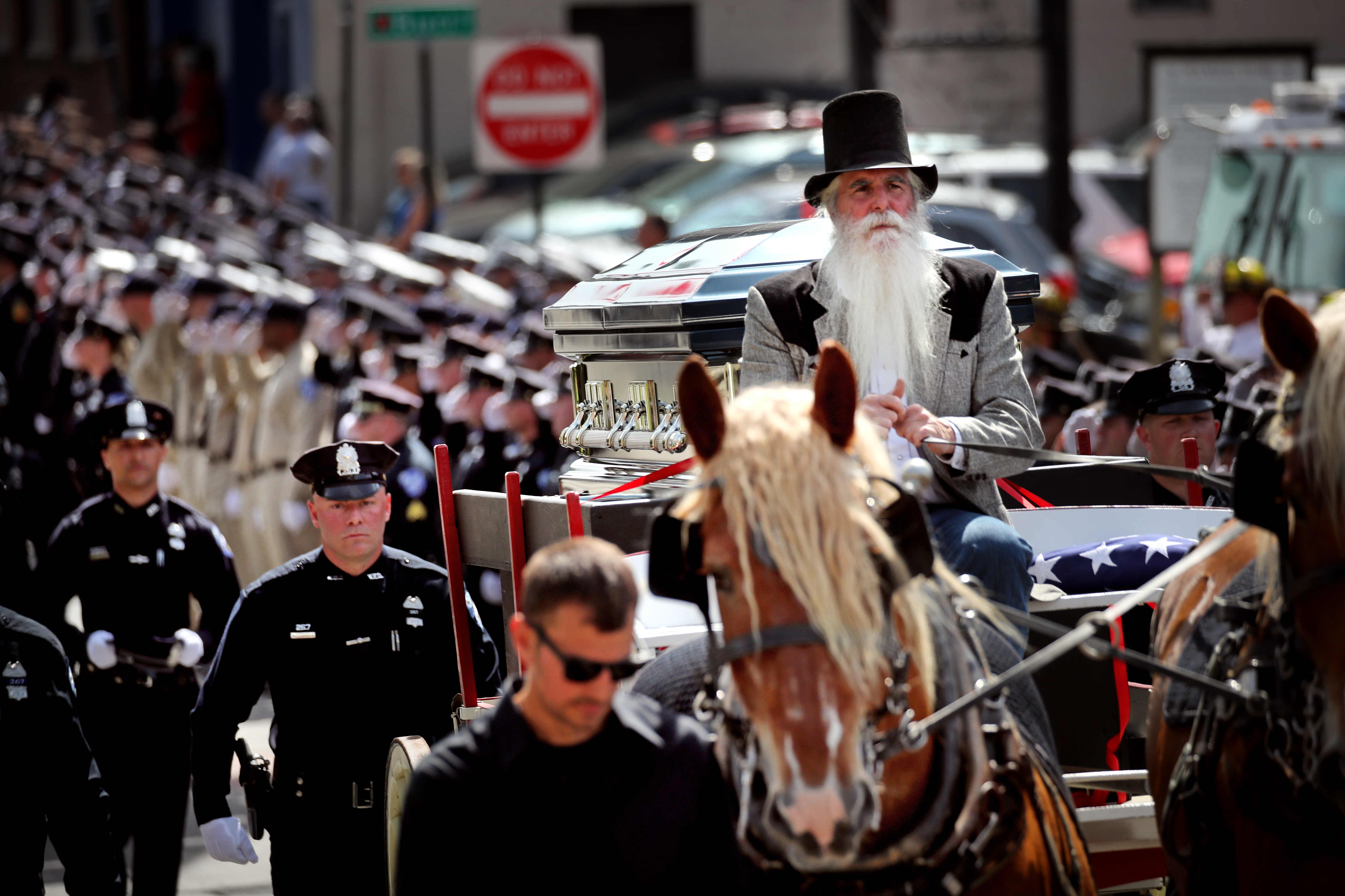 A horse drawn carriage carried the casket during a funeral service for Worcester Police Officer Enmanuel "Manny" Familia.