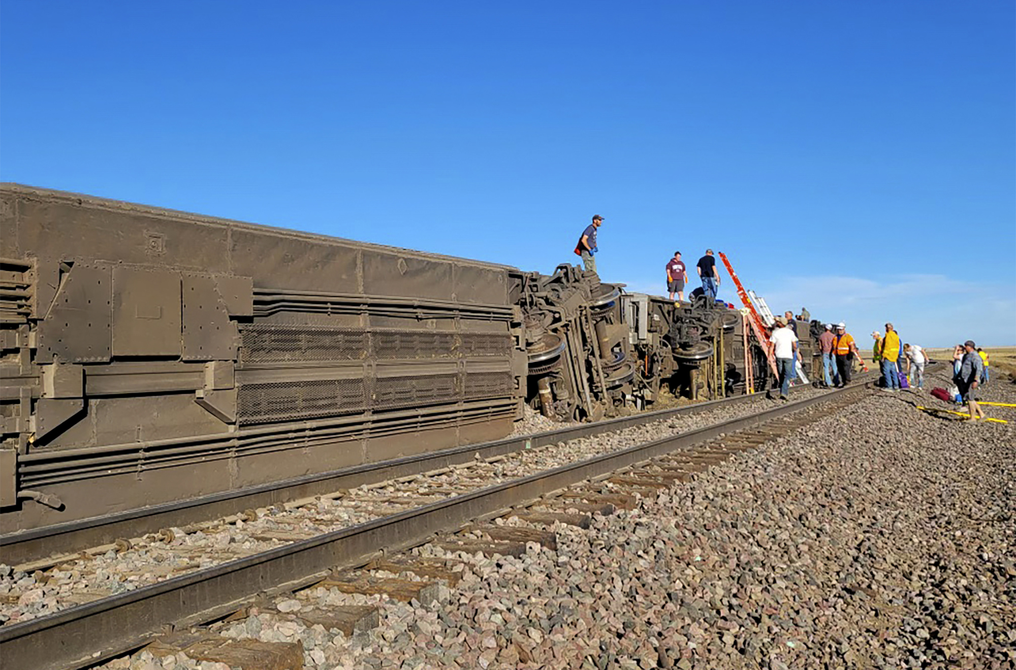 People work at the scene of an Amtrak train derailment on Saturday, Sept. 25, 2021, in north-central Montana.