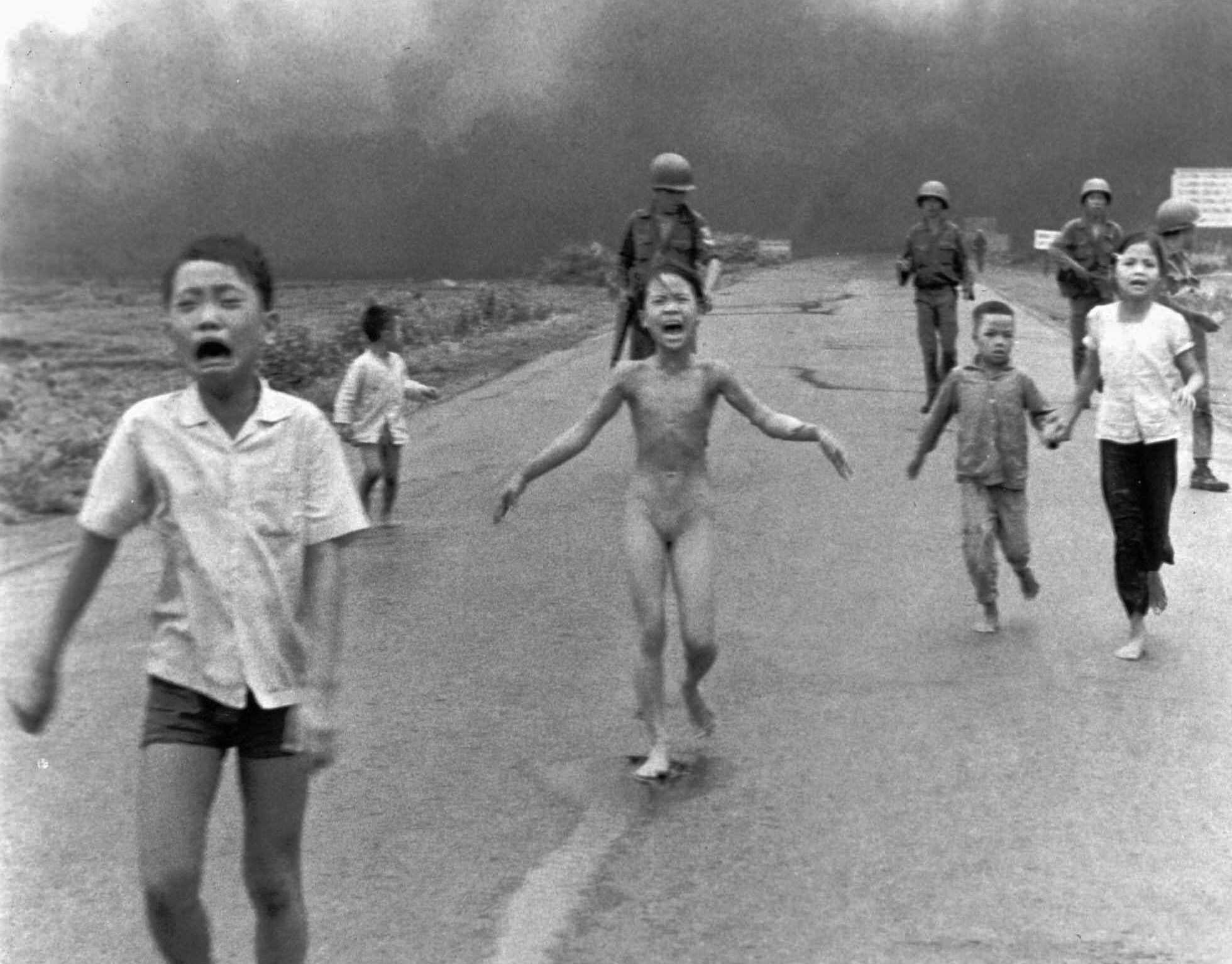 Kim Phuc (center) suffered burns from an aerial napalm bombing in 1972 during the Vietnam War that left her disfigured. She had ripped off her burning clothes while fleeing.