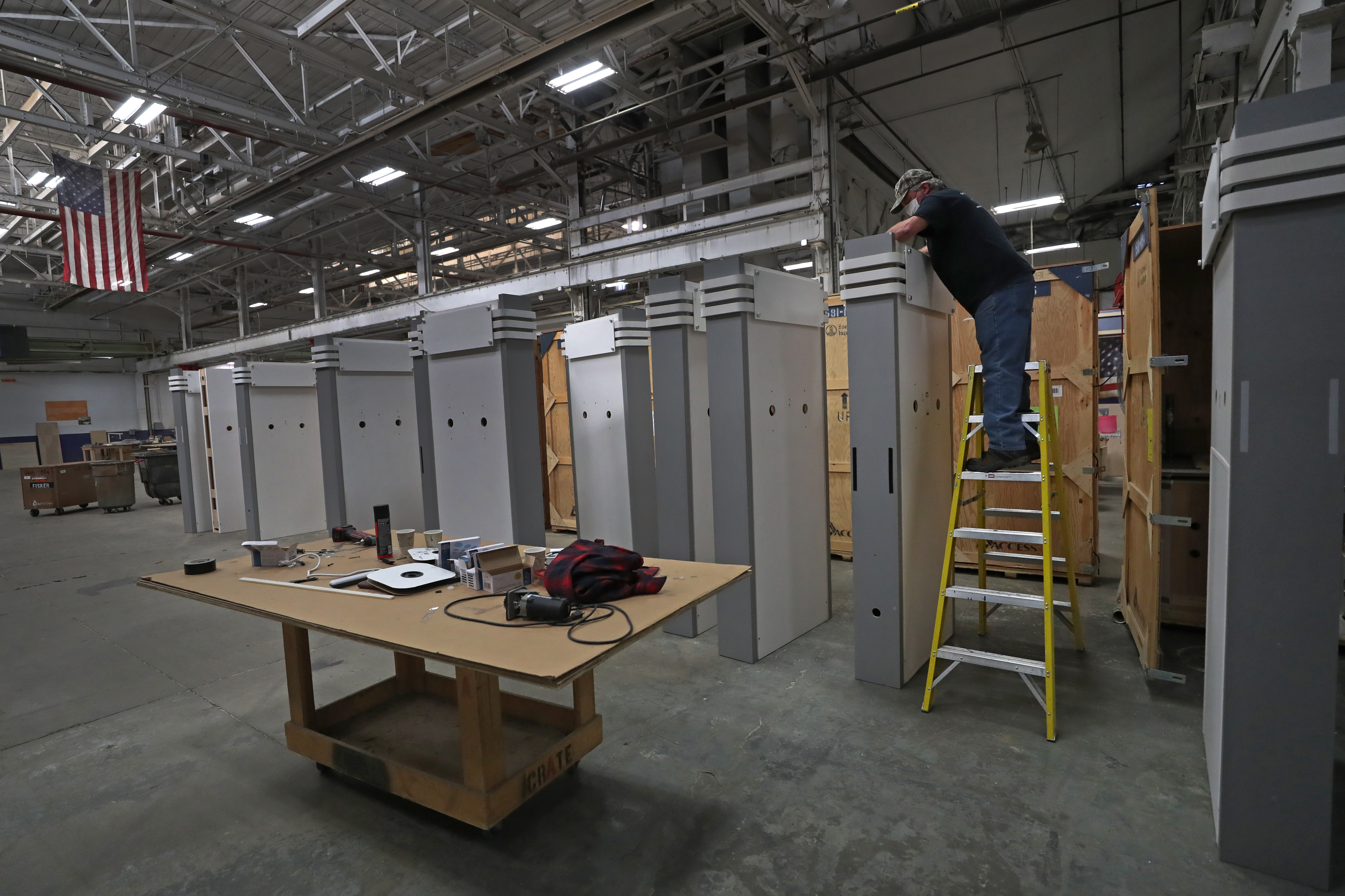Mark Varney, head carpenter of Access TCA, worked on a display for a customer at the warehouse shop in Whitinsville.