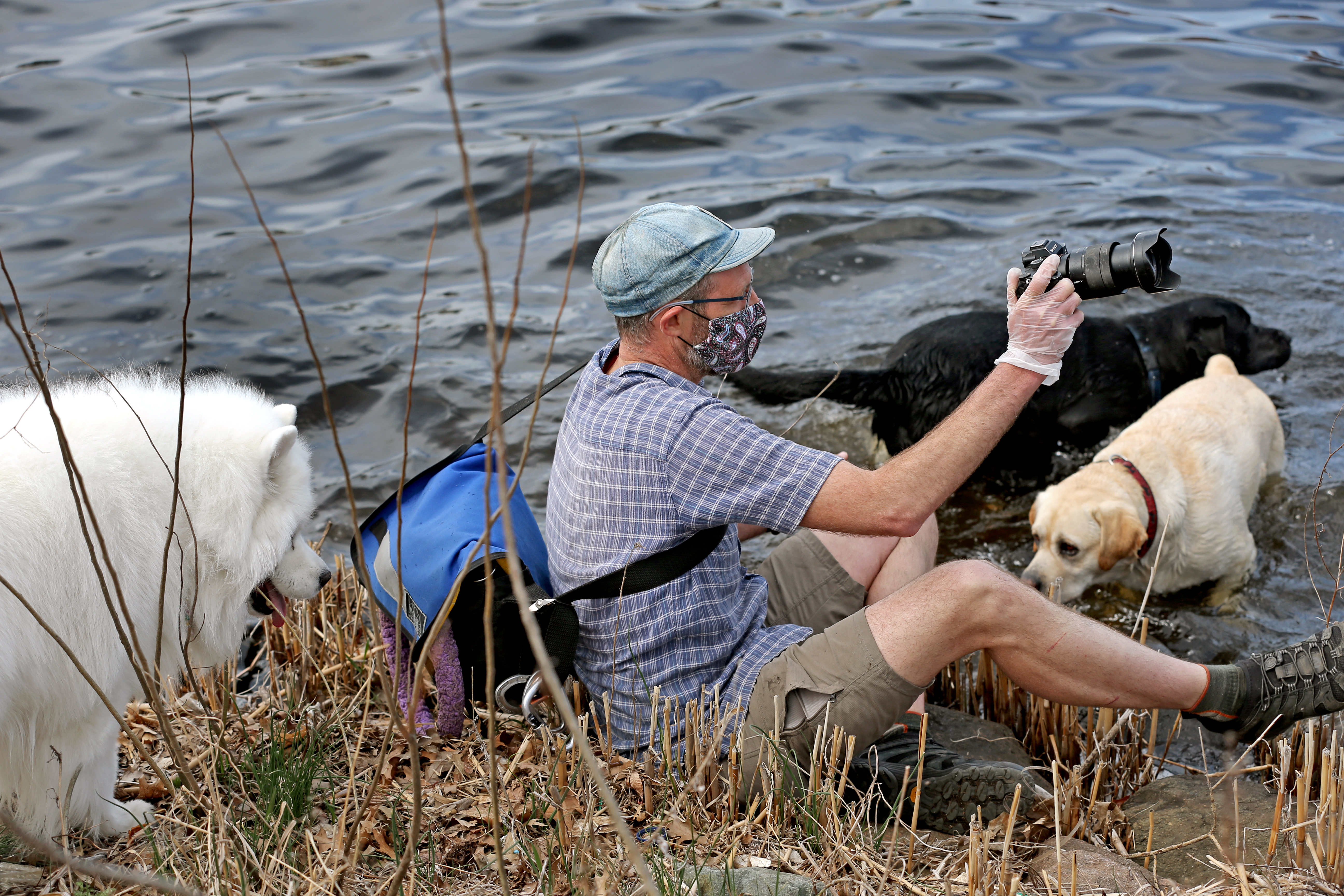 Watson sat at the bank of Charles River during his photography session on Tuesday.